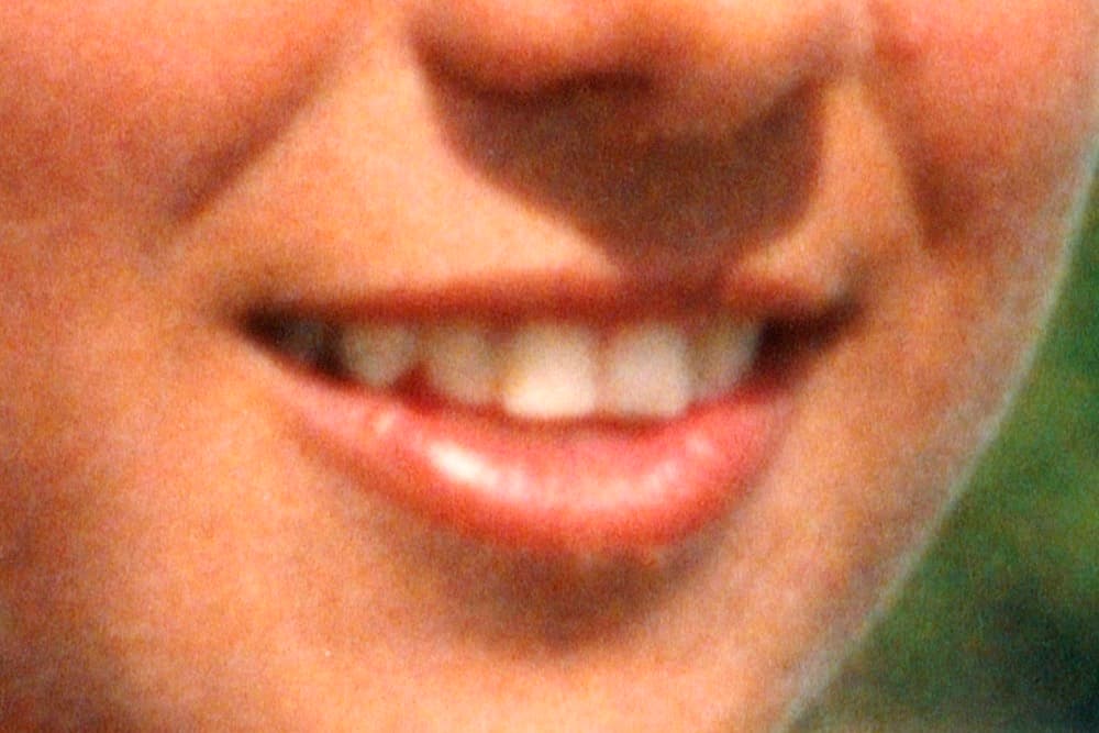 Archival image showing a close-up of the smile of the artist's mother. © Eleonora Agostini