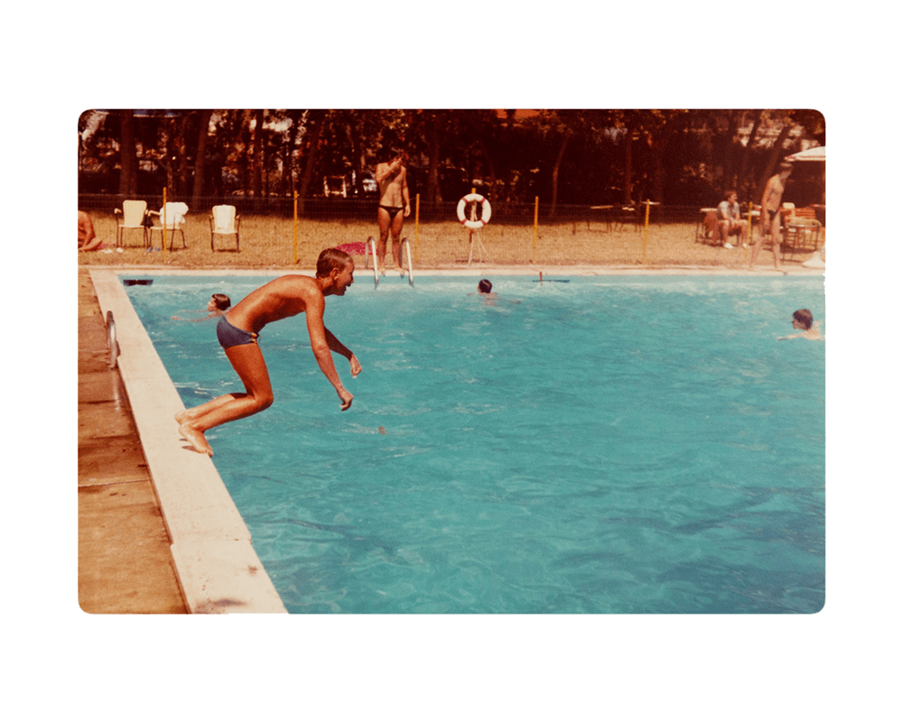 Archival holiday picture from the artist's personal archive, showing a boy jumping into a pool © Sander Coers