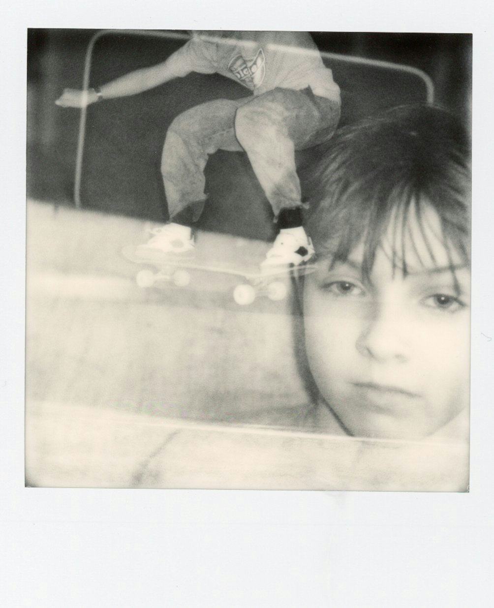 Polaroid of kid and someone skating