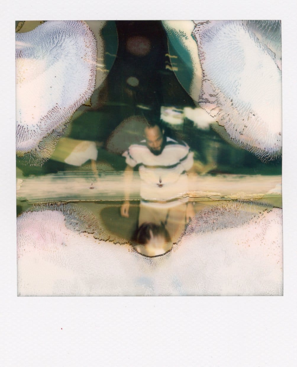 Damaged Polaroid of man skating