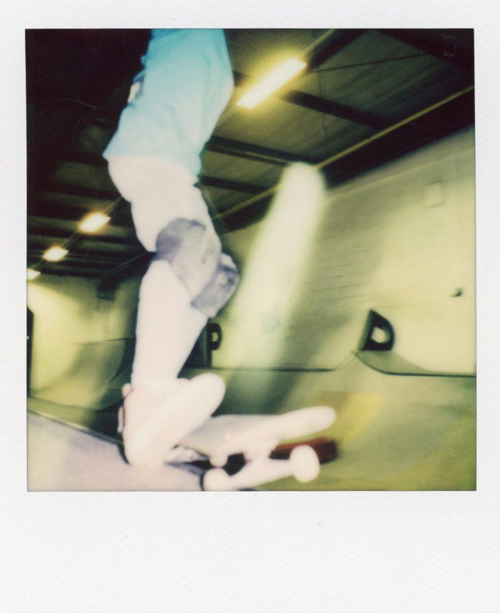 Polaroid of kid skating on ramp