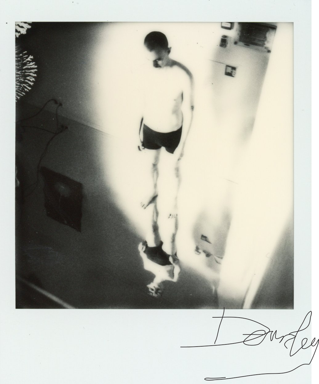 Polaroid BW man standing in underwear