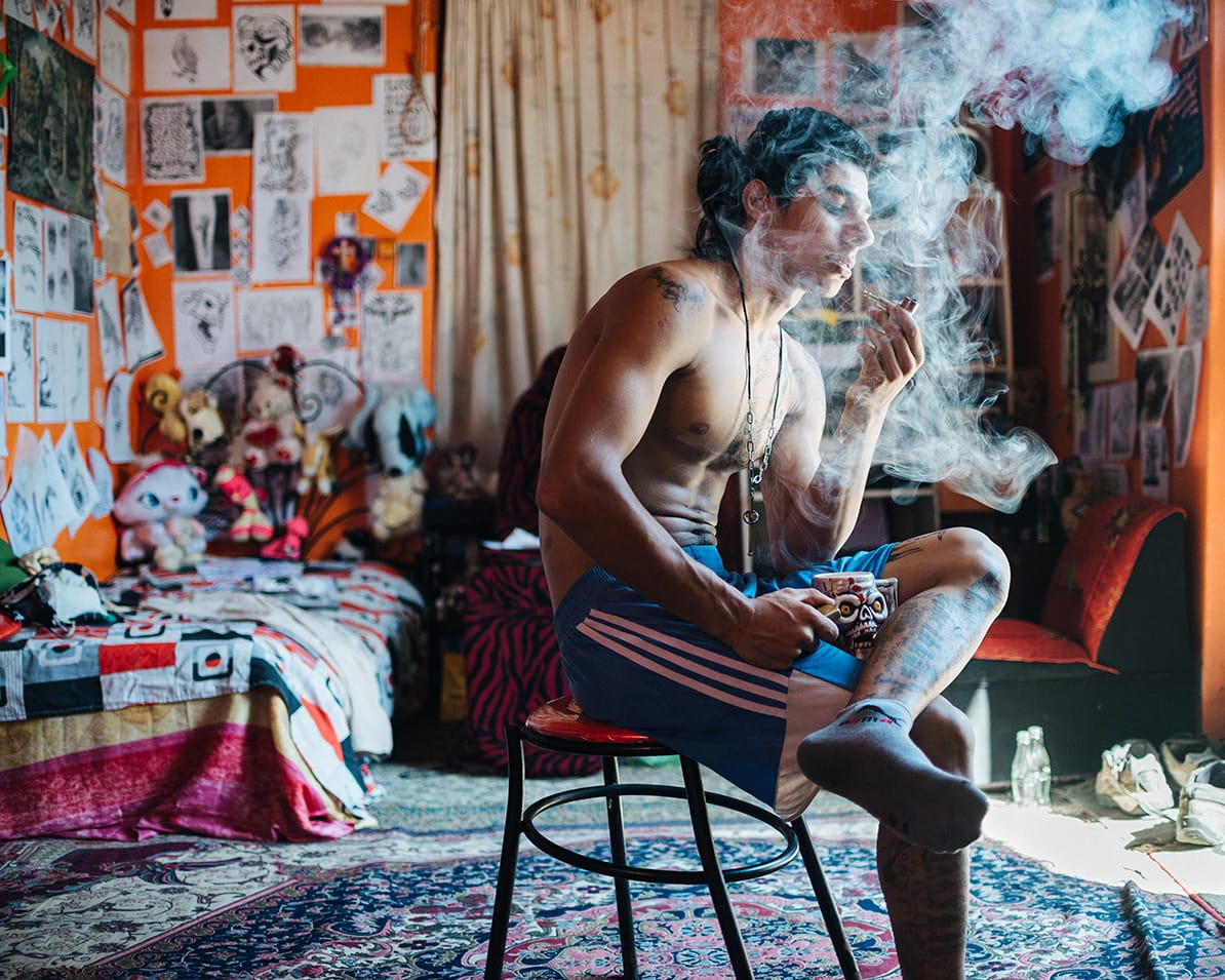 boy smoking in room