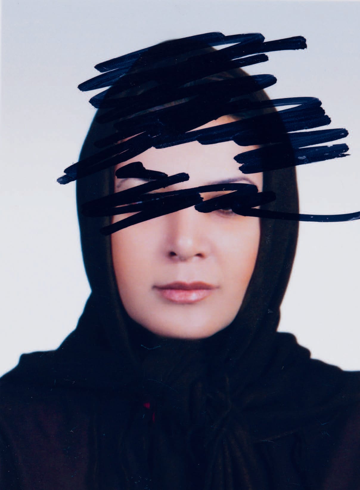 A person wearing a black headscarf with eyes scribbled over in black marker on a white background.