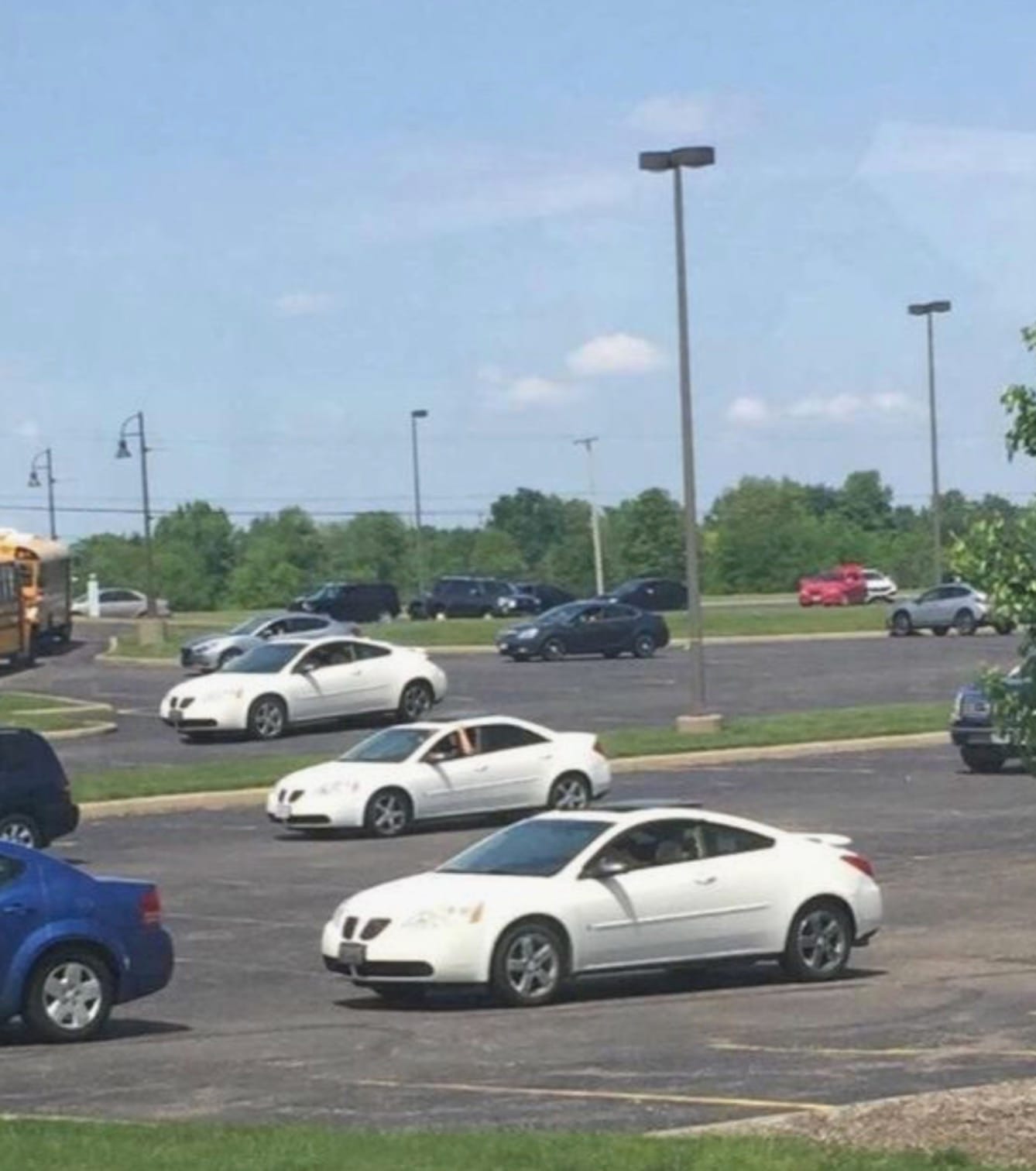 Picture of three identical cars, parked in a row.