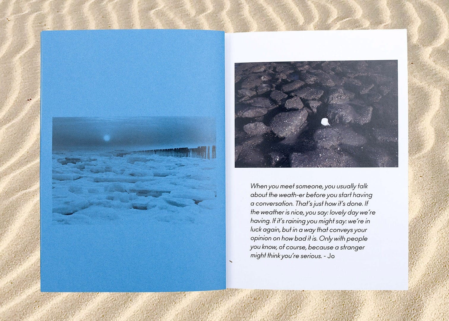 image of sand with open book