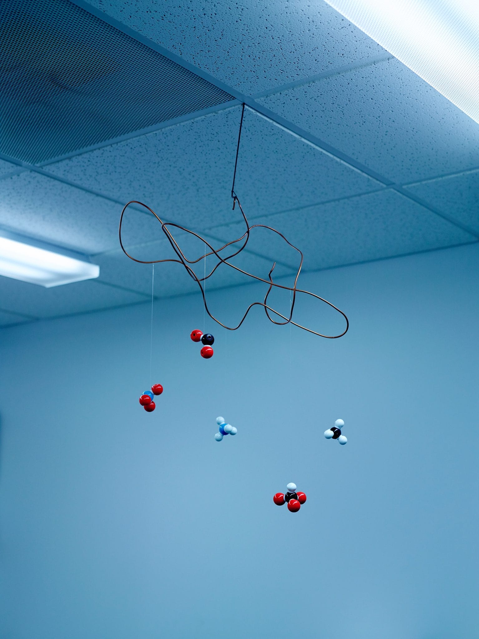 A model of plastic molecules hanging from the ceiling.
