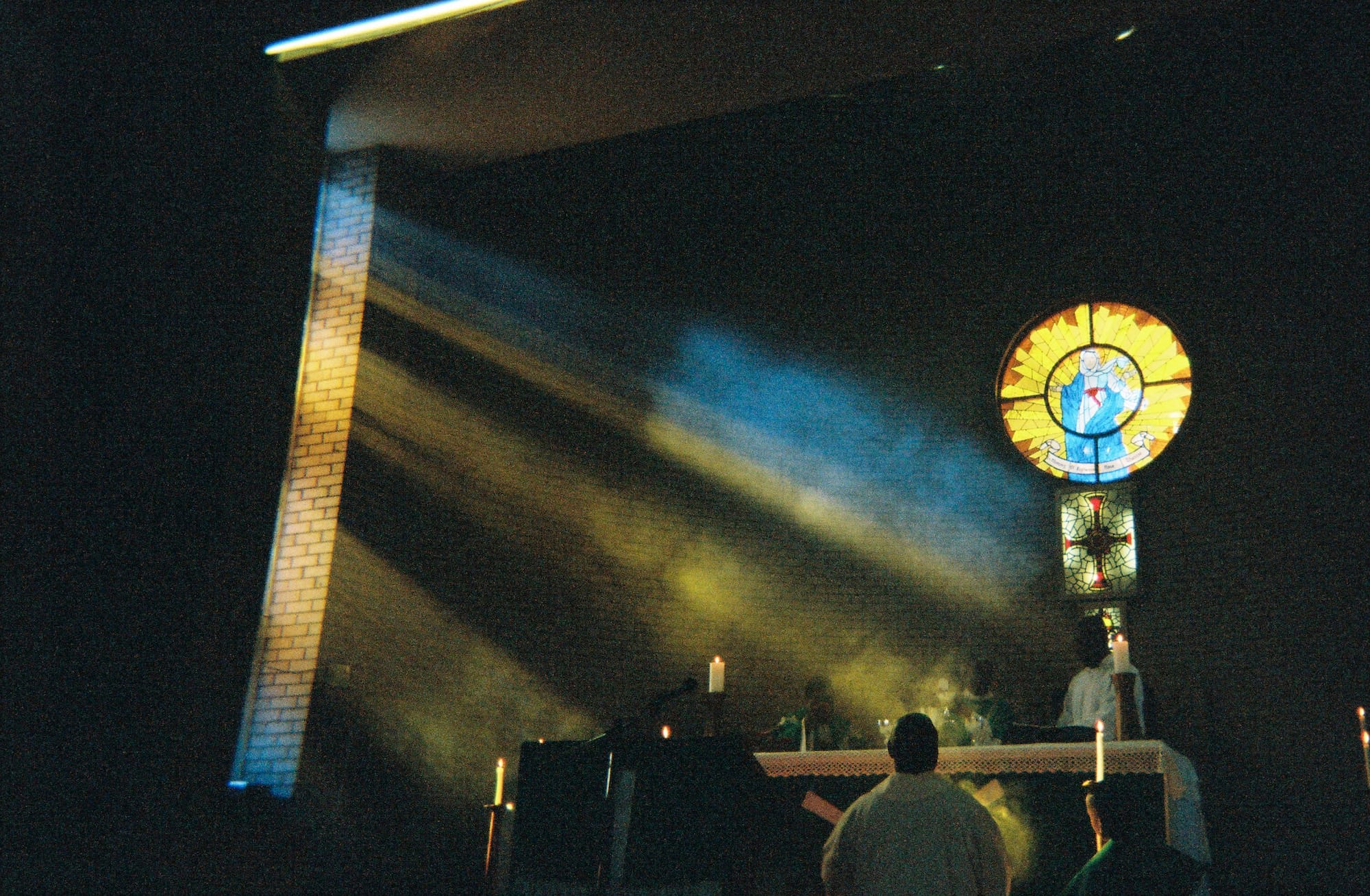 Image of light falling through a coloured window in a church. © Thero Makepe