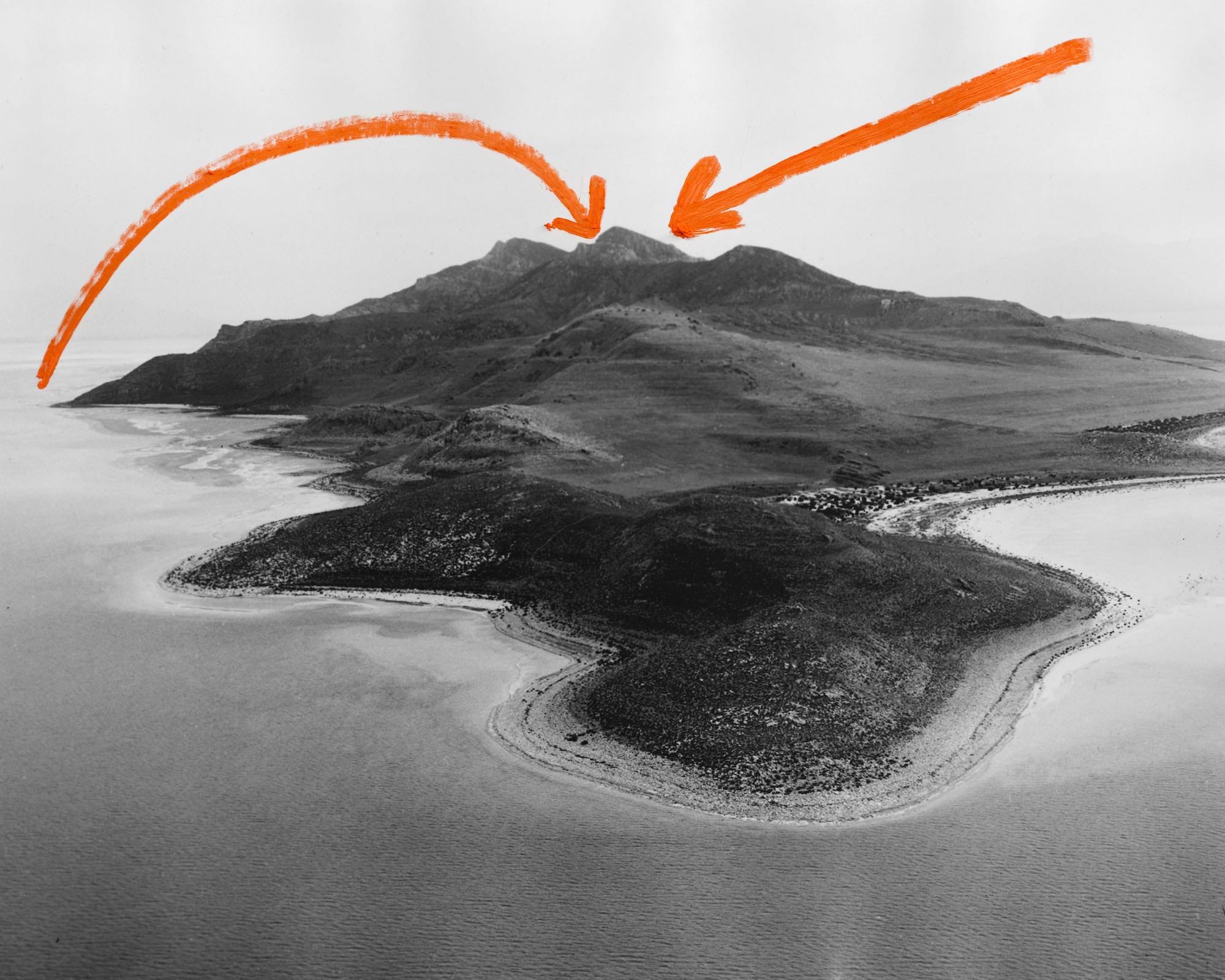 Archival aerial image of Stansbury Island in the Great Salt Lake (Utah), with two arrows in red paint drawn on top. © Jaclyn Wright