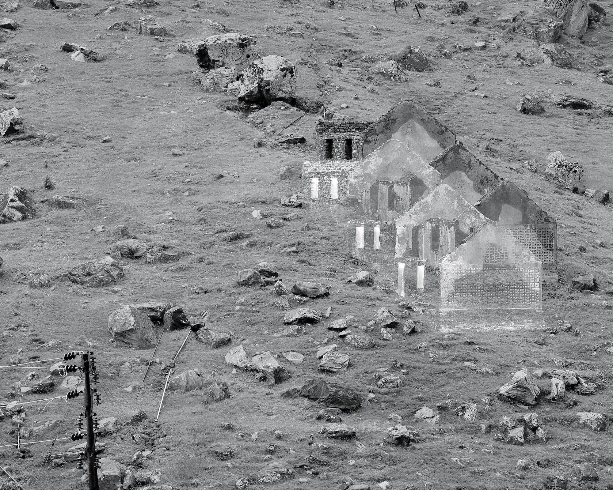 Black and white image of a mountain slope with rocks and outlines of a house edited on top. © Aaryan Sinha