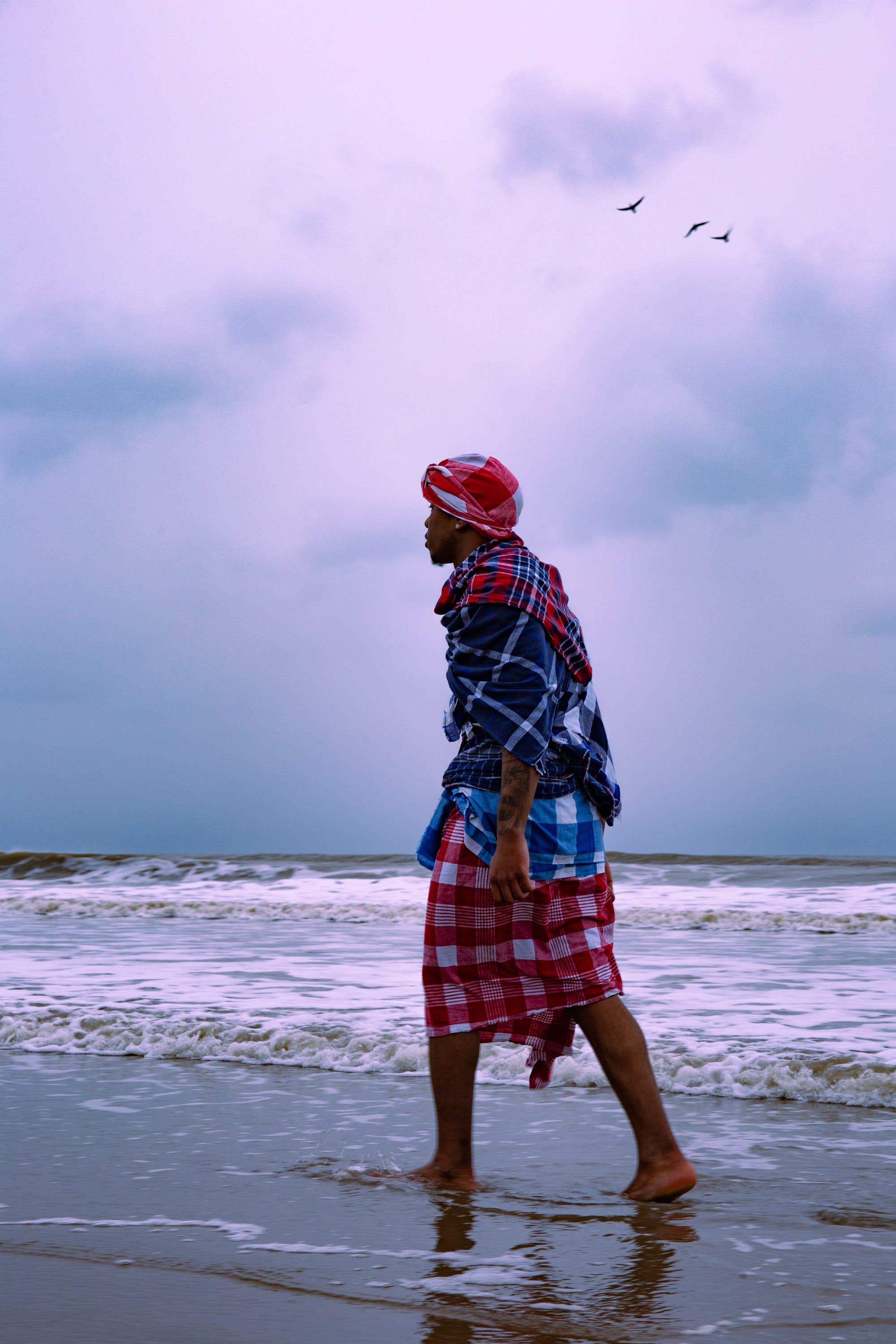 Photo of black man on the beach. © Iyanla Etnel