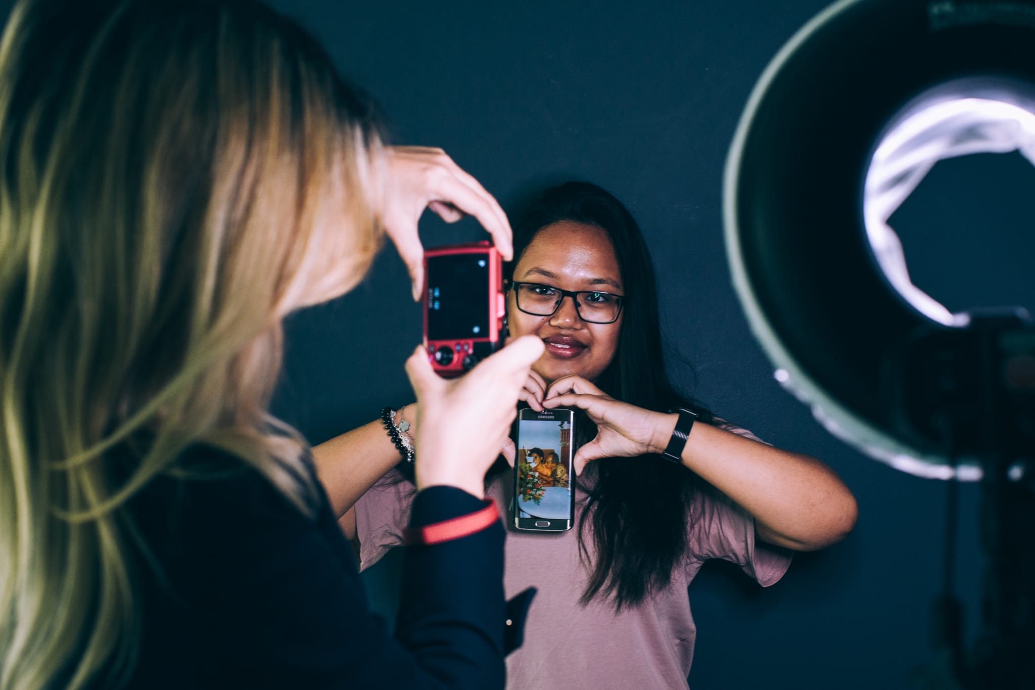 Two students making portraits of one another