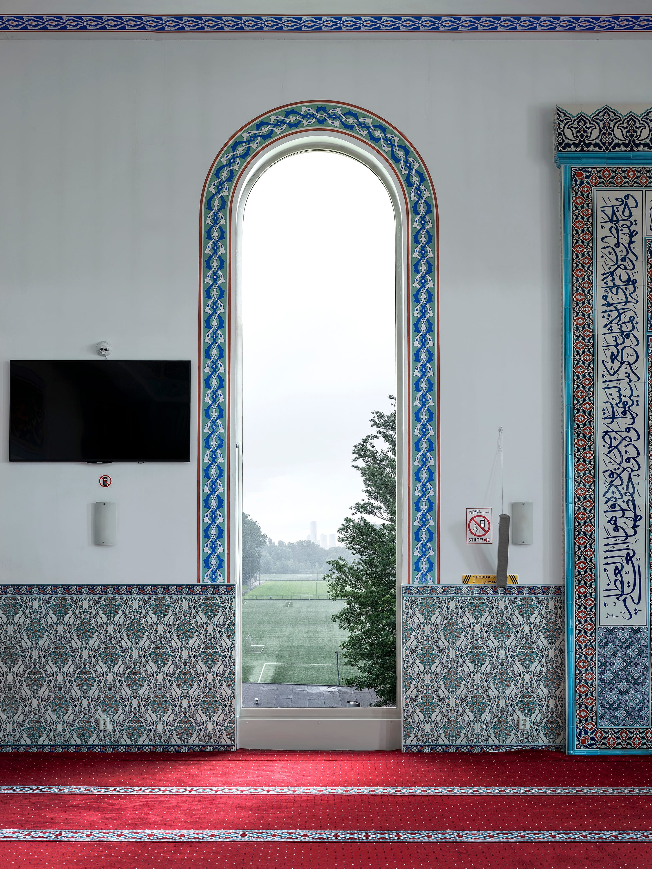 View from inside a mosque onto a Dutch landscape