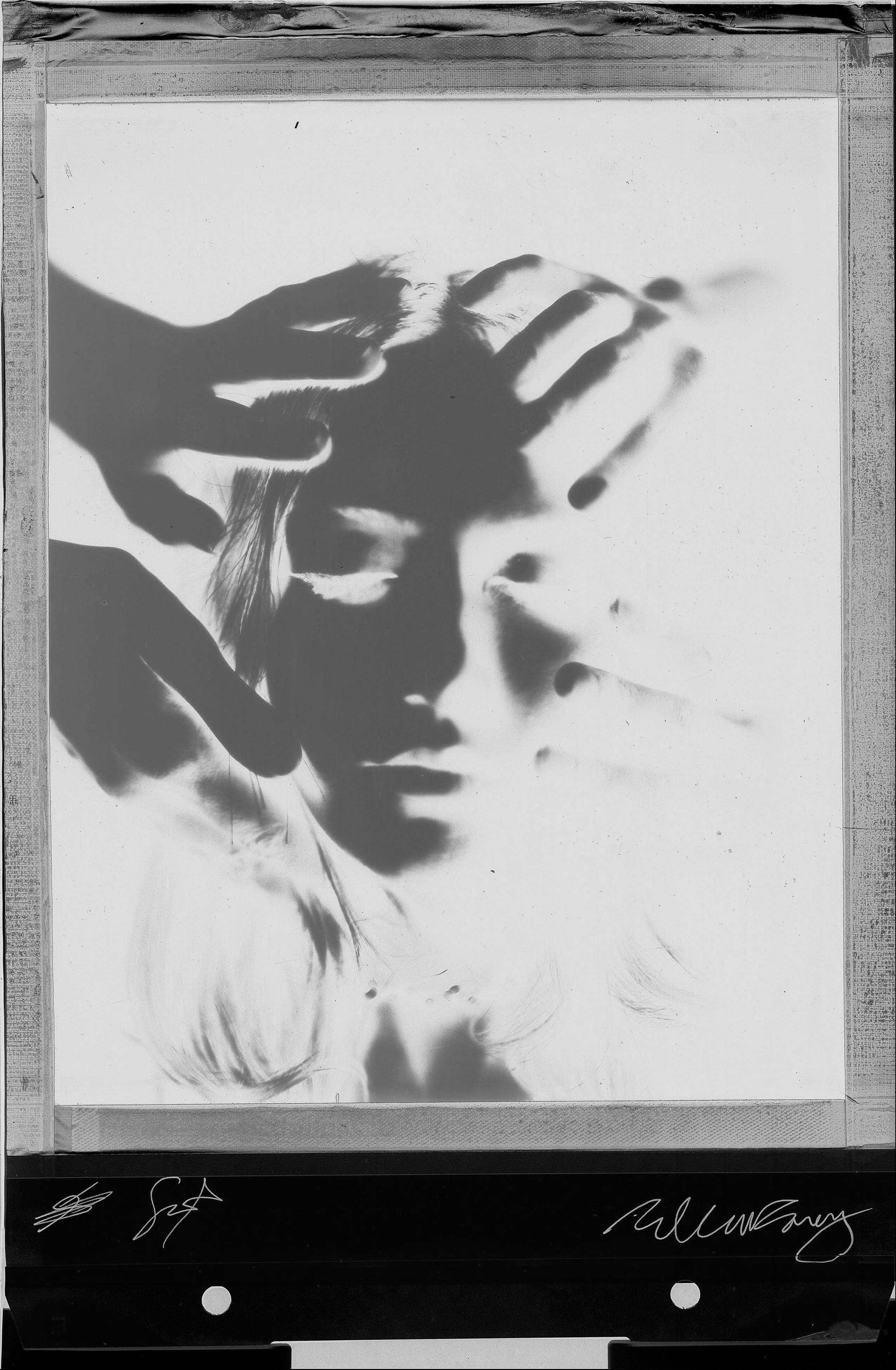 Polaroid portrait woman hands on face BW