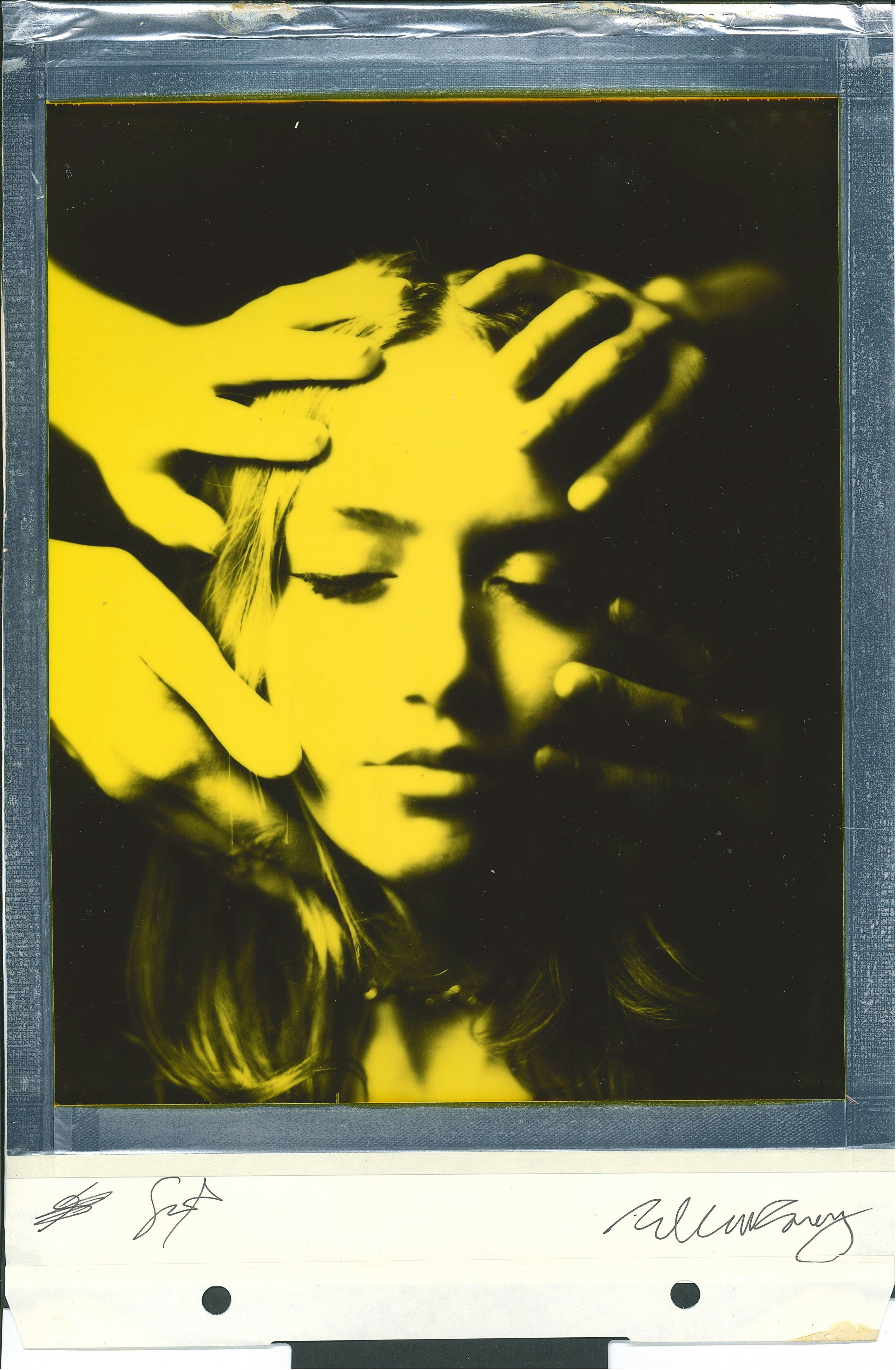 Polaroid portrait woman hands on face yellow