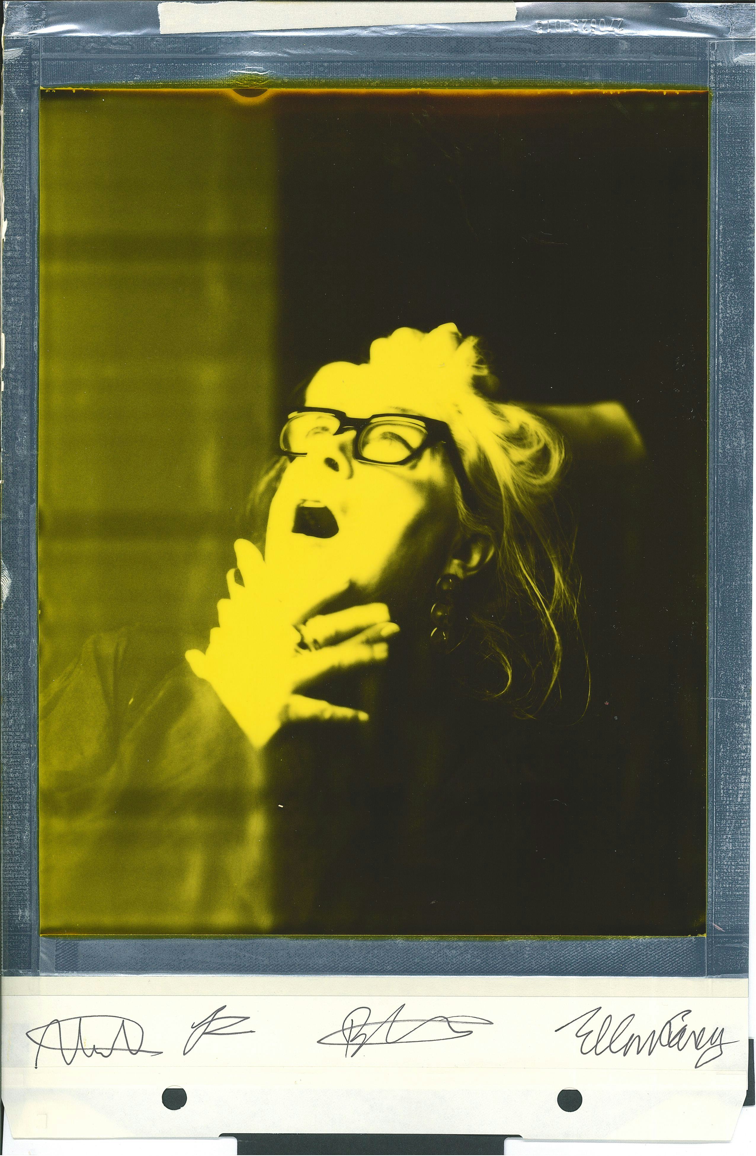Polaroid portrait woman looking up yellow