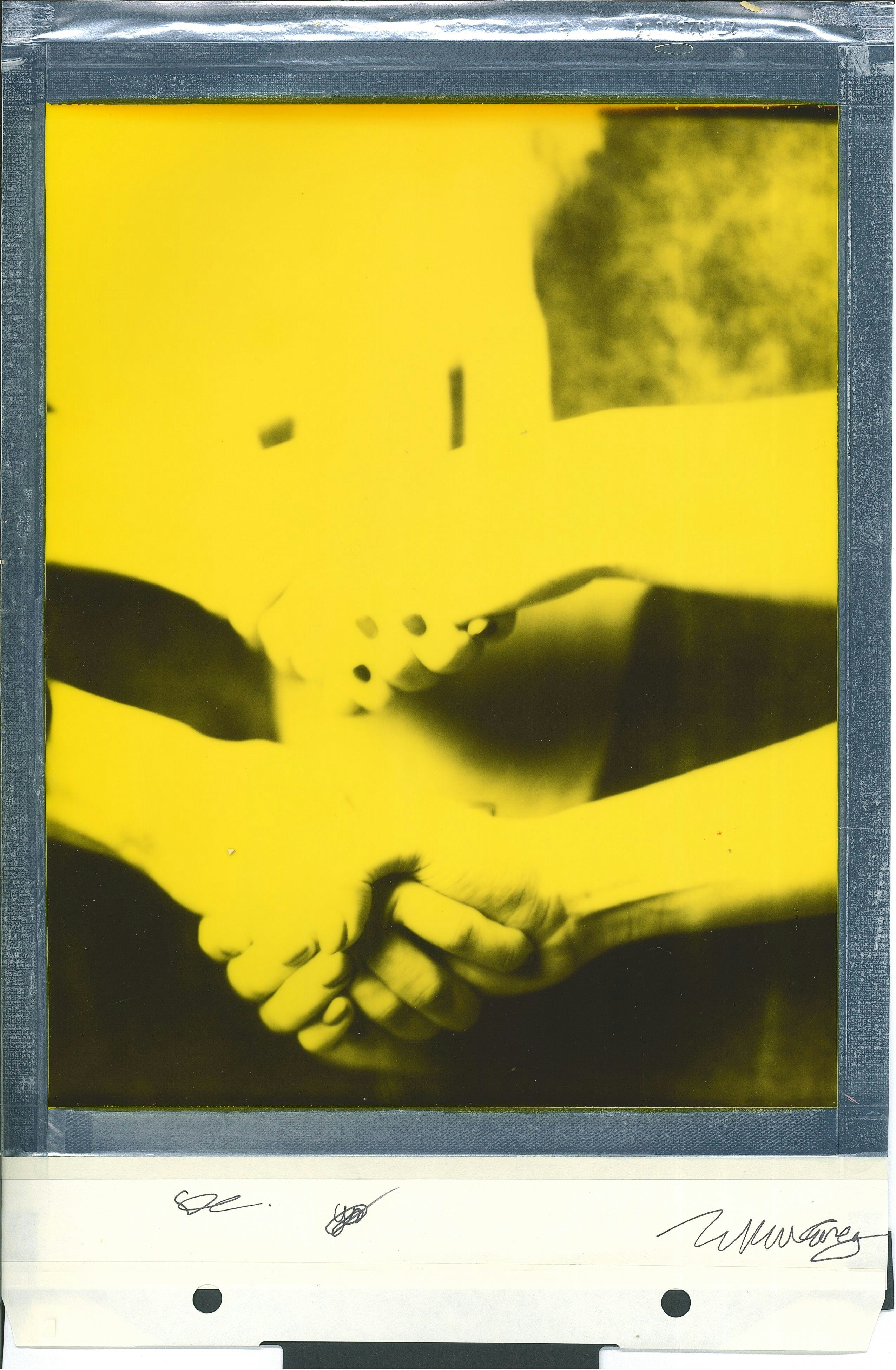 Polaroid handshake yellow
