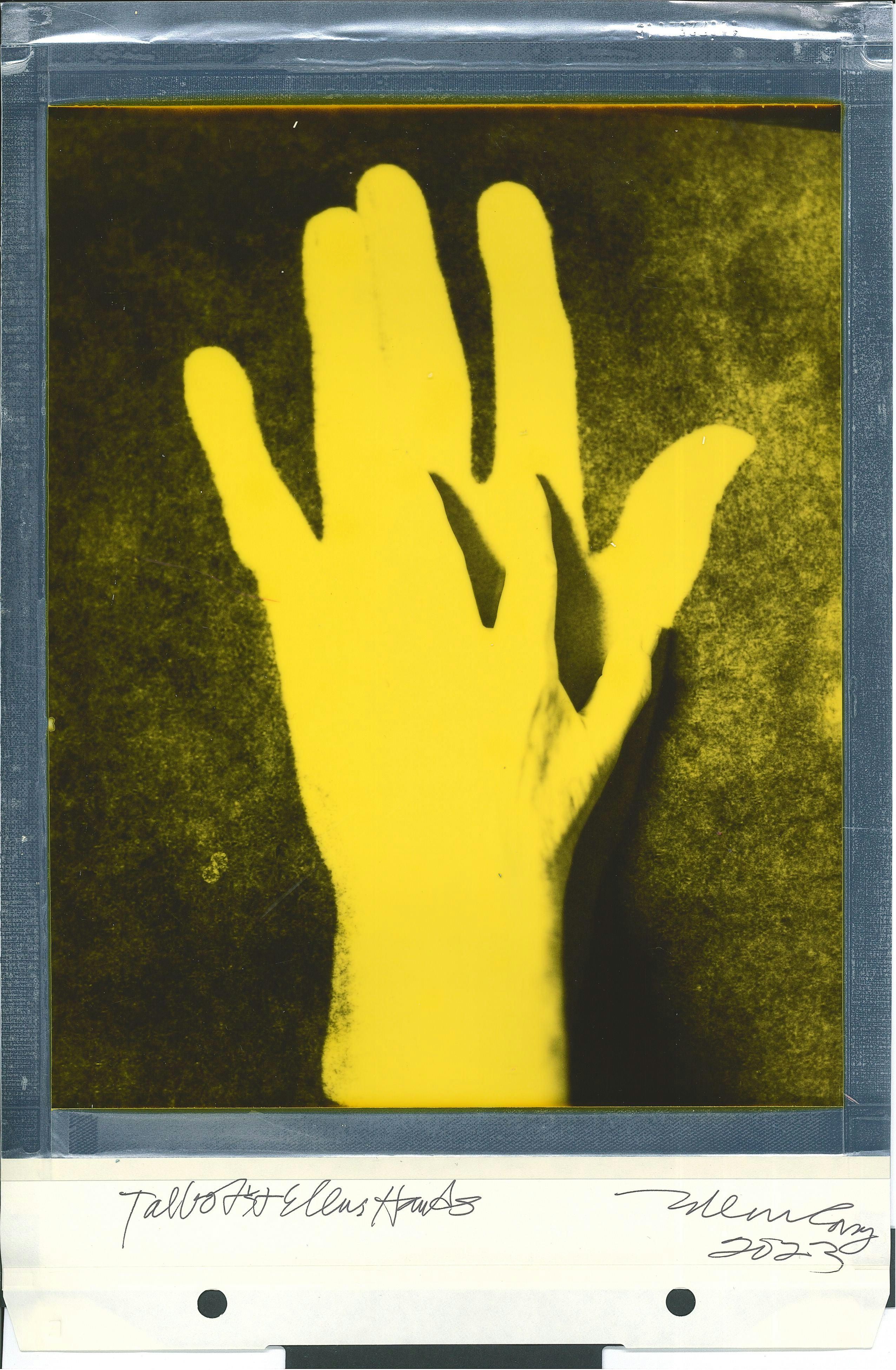 Polaroid yellow hand