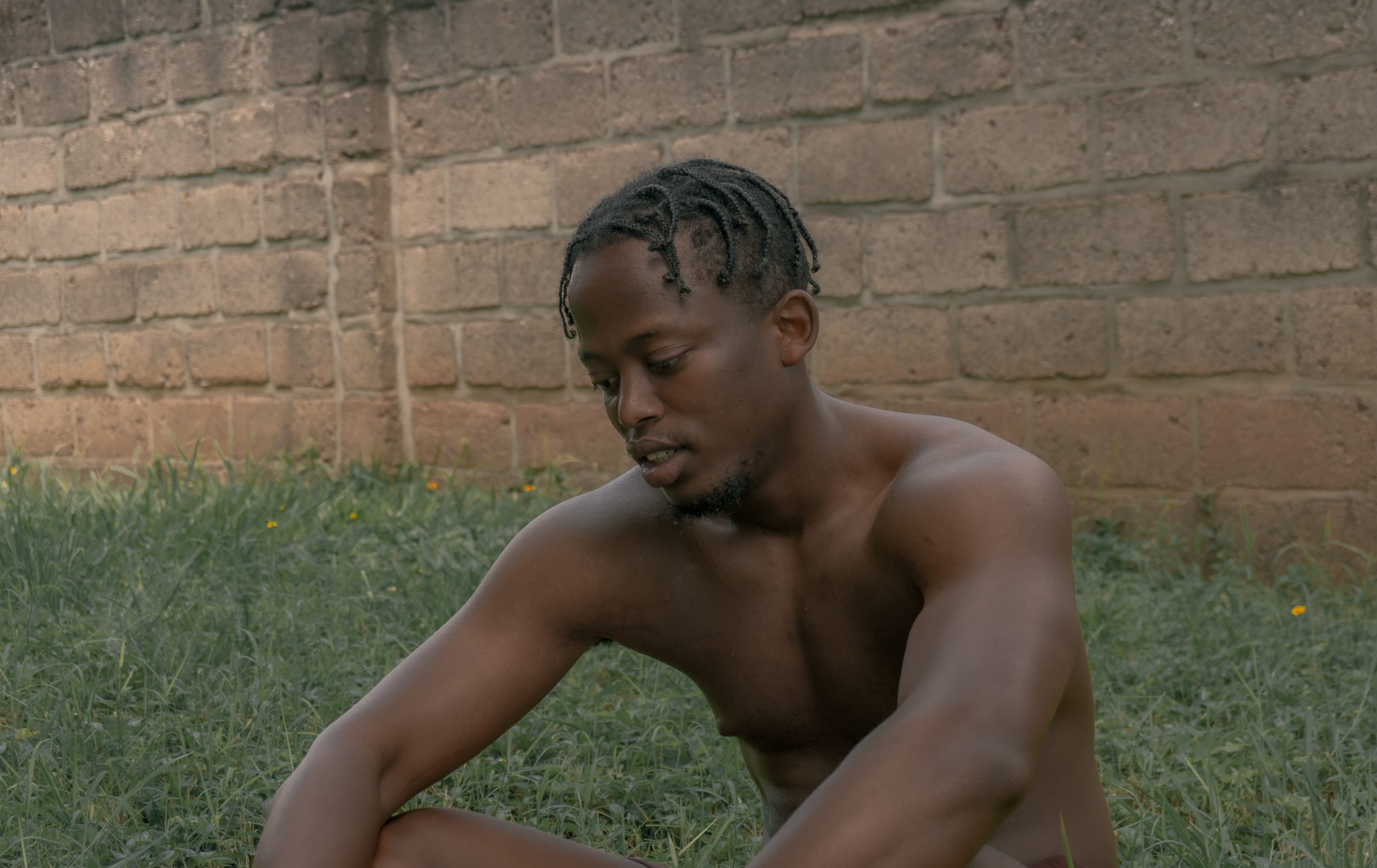 Portrait of a young black man, topless. © Tal Ben Yakir