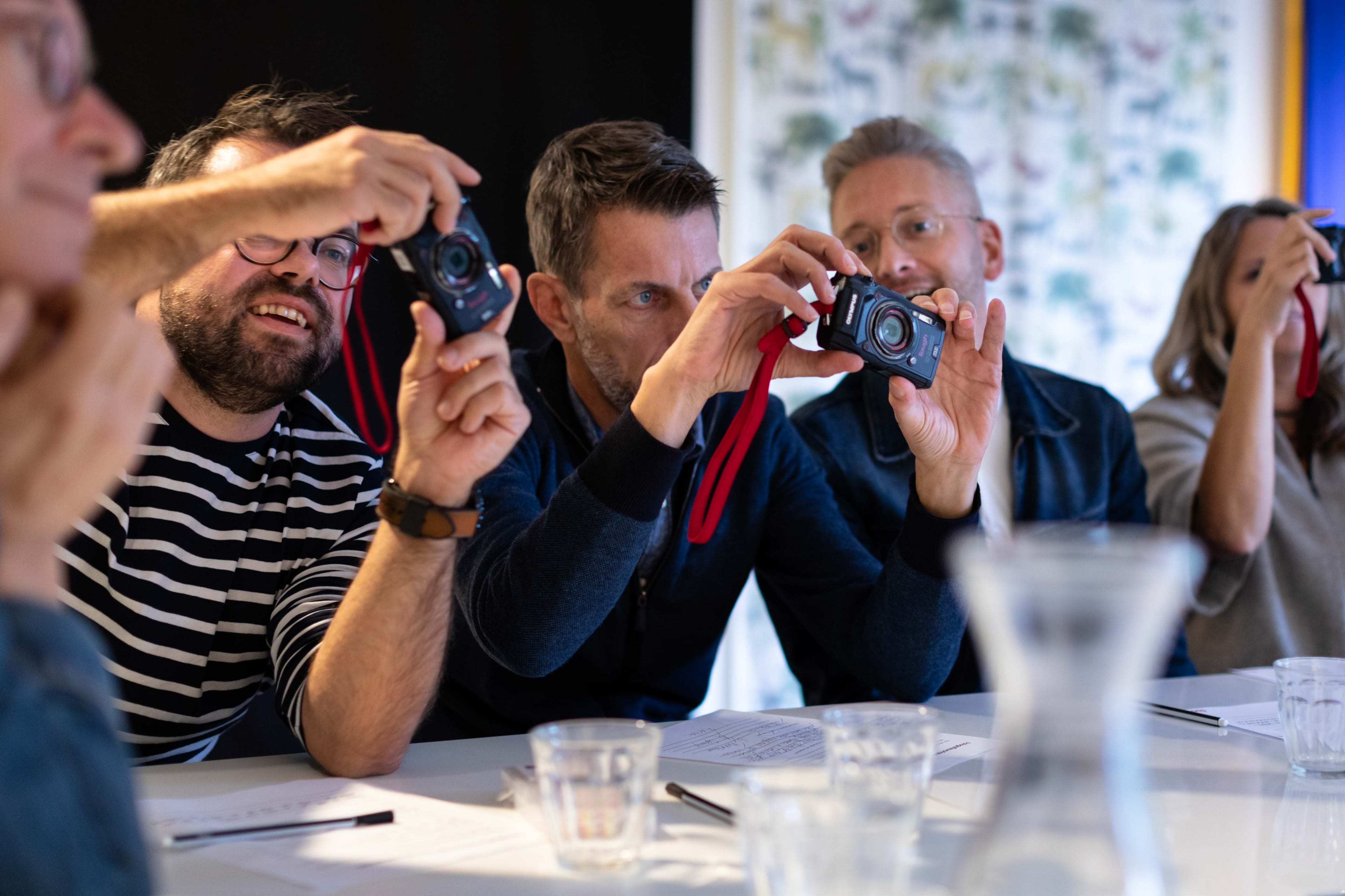 Teachers play with cameras during the teacher workshop