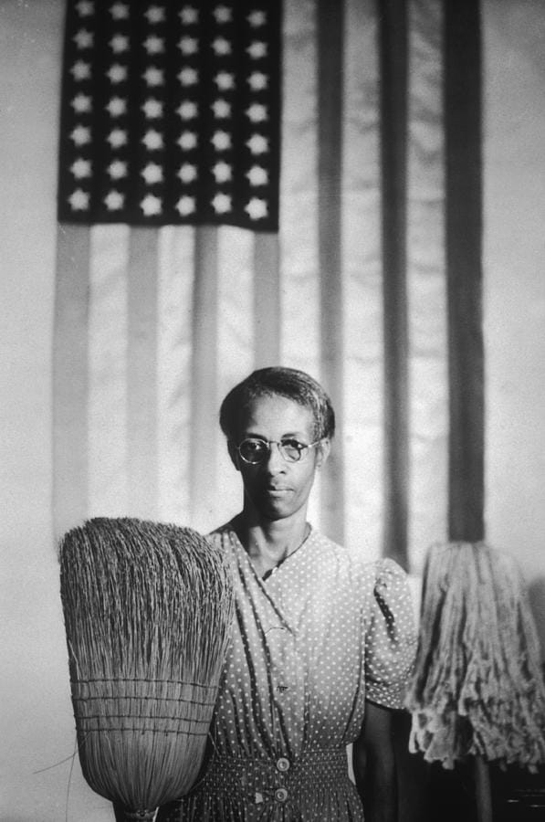 Person Standing In Front of American Flag