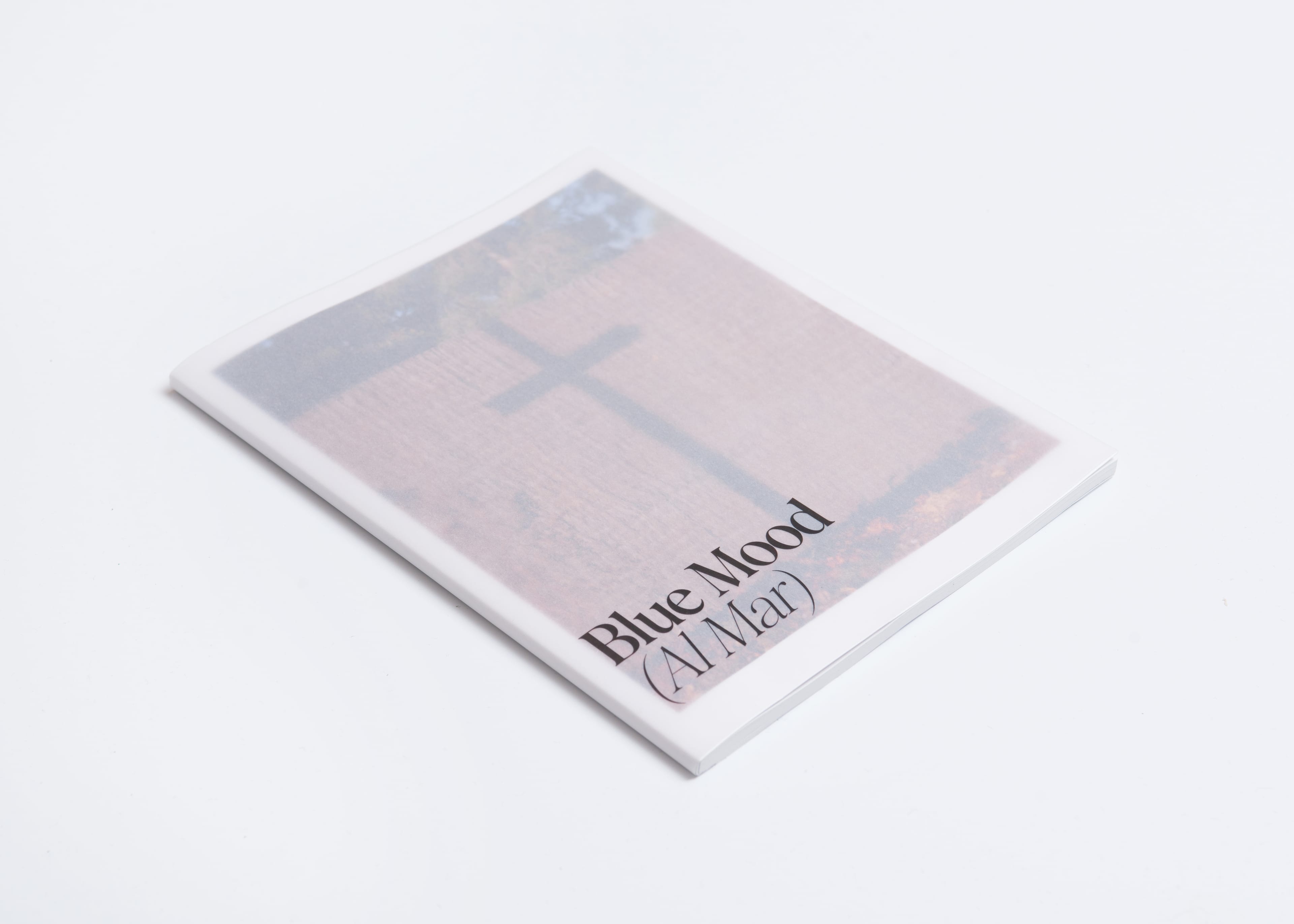 Cover of a photo book with a cross displayed on the front.