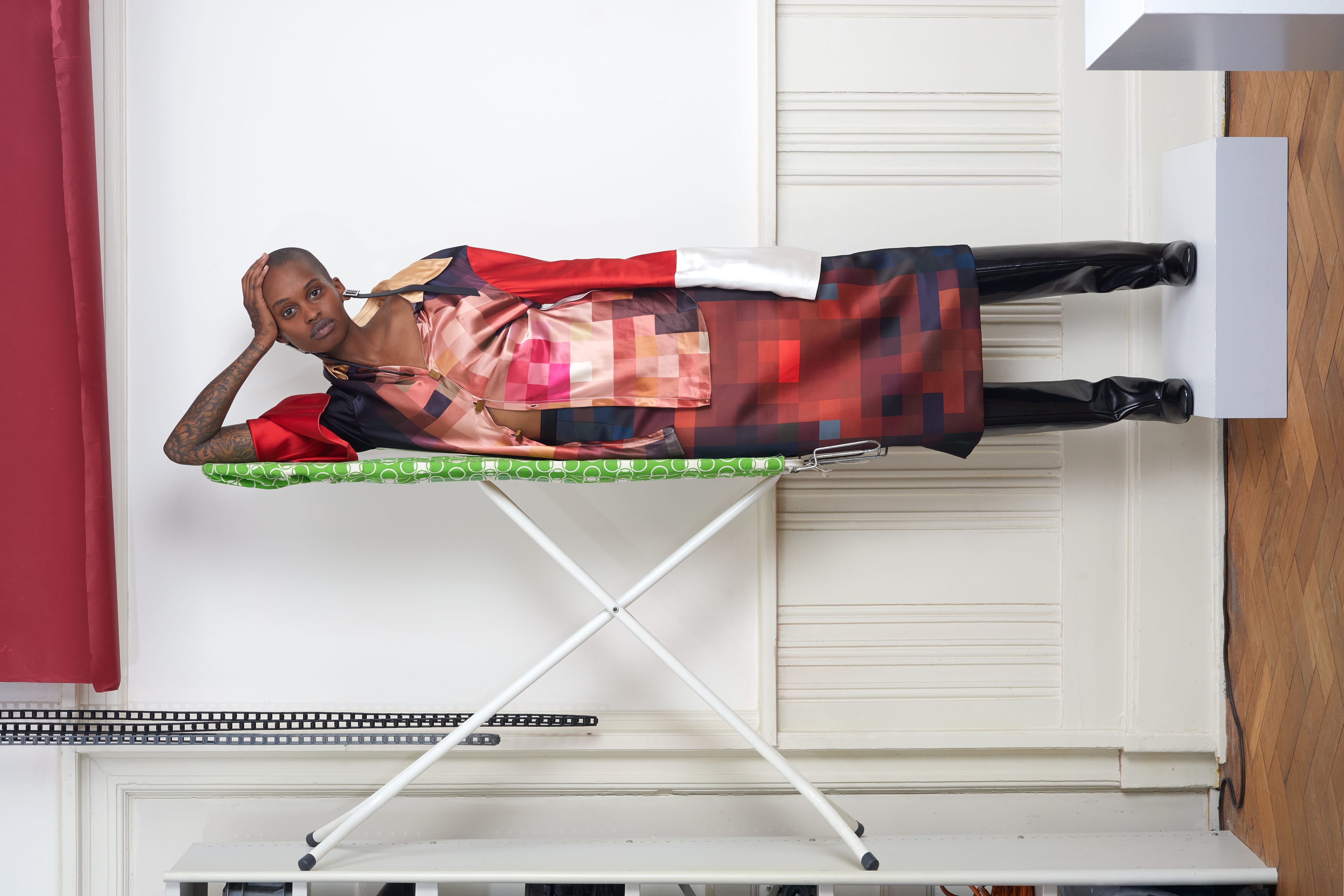 woman lying on ironing board