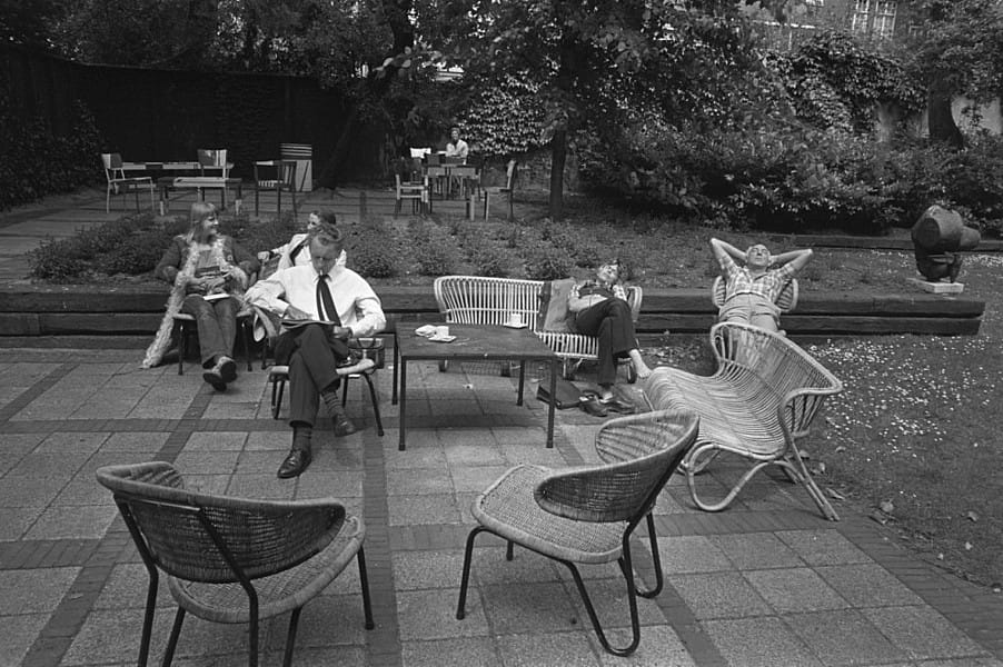 BW picture of people relaxing in garden of Foam