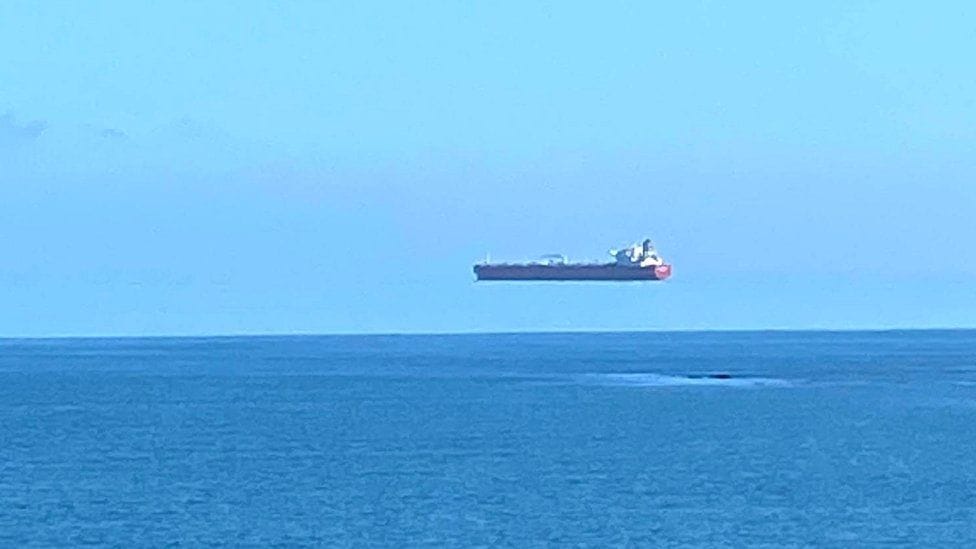 Screenshot of an oil tanker appearing to float above the ocean.