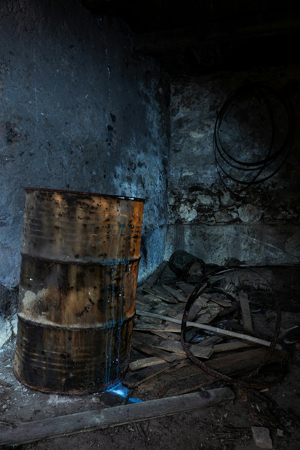rusty barrel in a decayed room