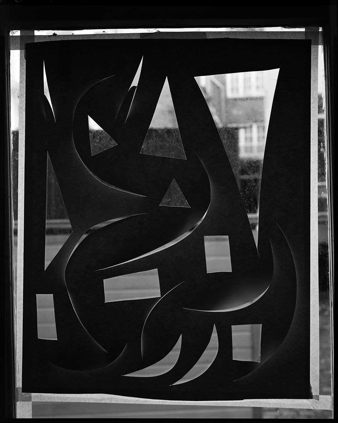 black and white photograph of an object with reflecting elements