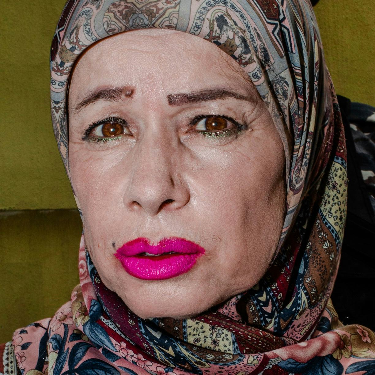 woman wearing headscarf and pink lipstick