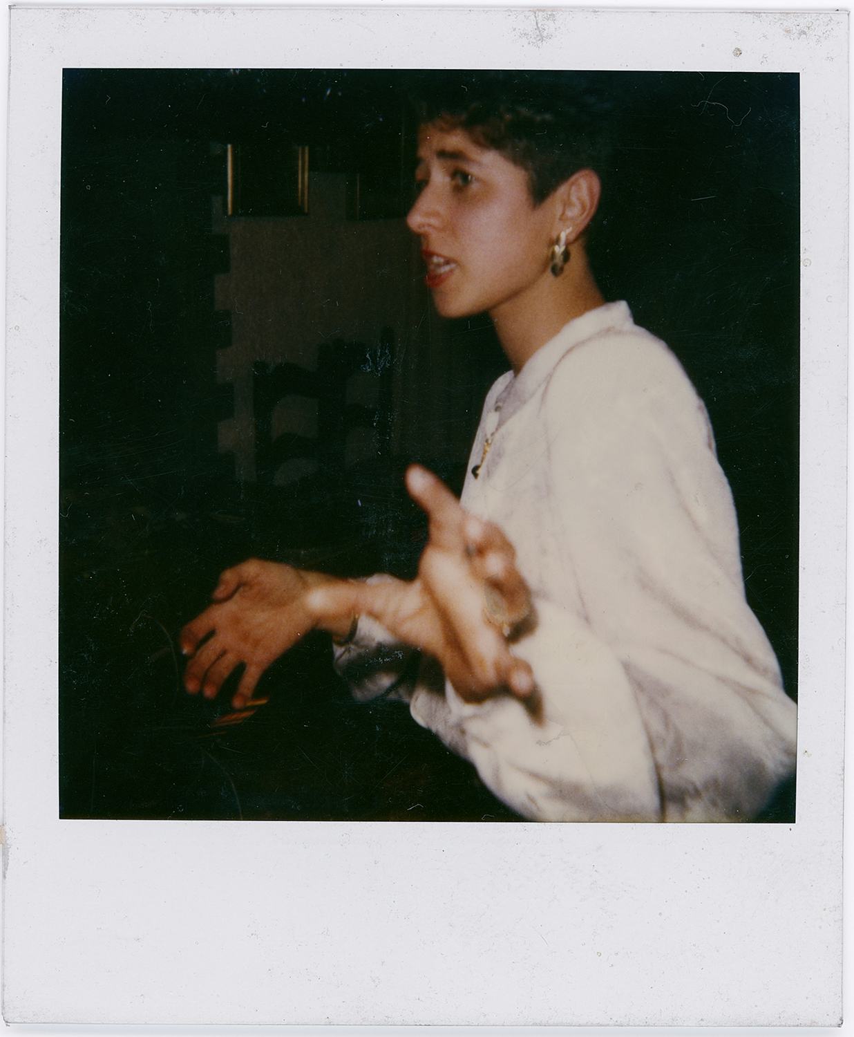 Polaroid photograph showing the artist's mother as a waitress. © Eleonora Agostini
