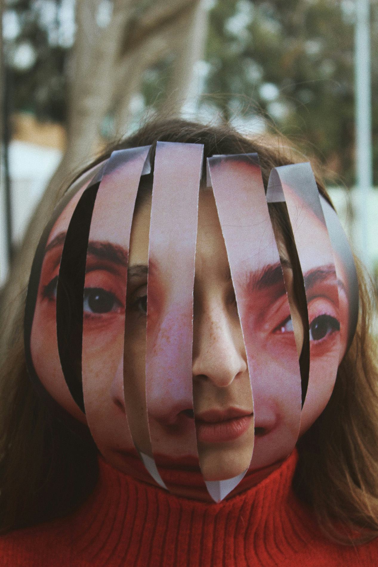 Portrait of a woman with a picture of herself in cut-out strips over her face. © Alp Peker