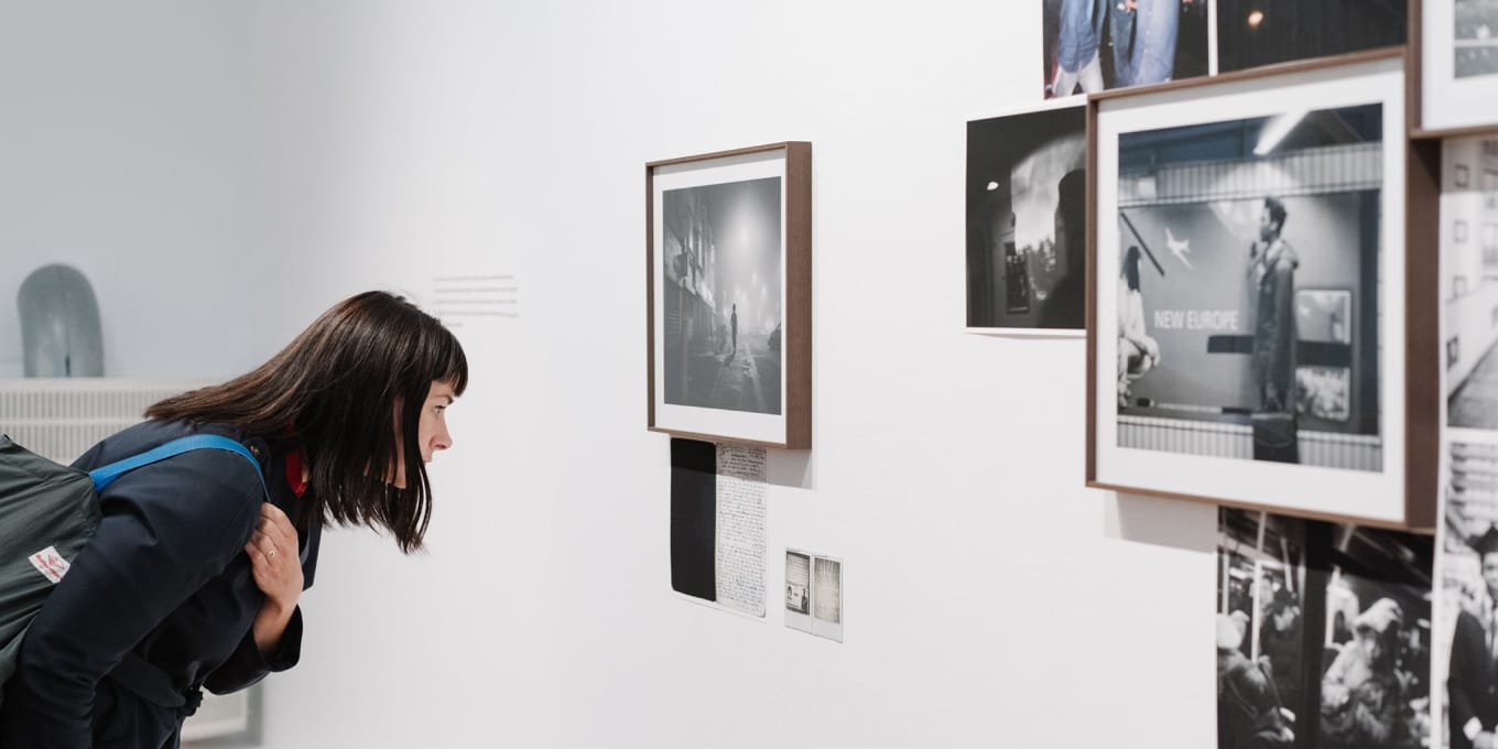 woman looking at photograph