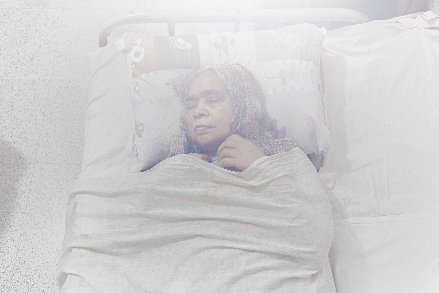 woman sleeping in white bed