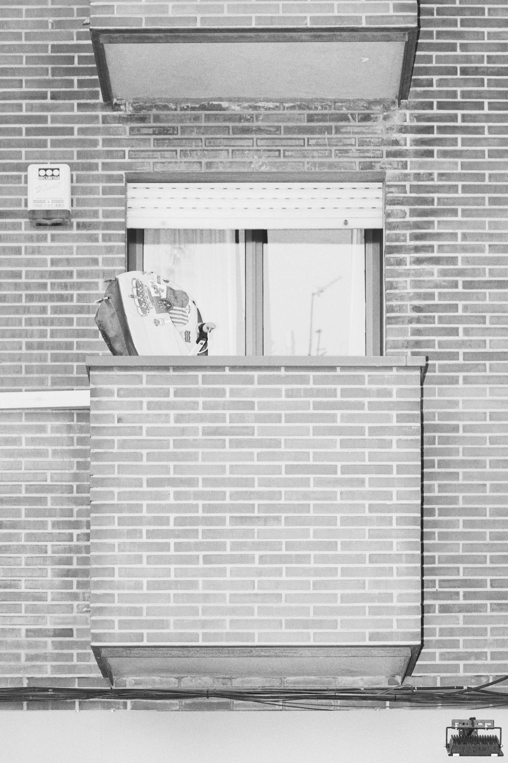 Black and white photo of a brick balcony. © Ignacio Navas