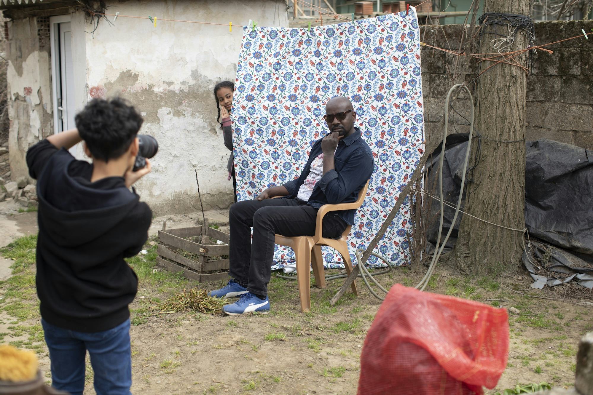Ahmet Sezer being photographed by his son Ahmet