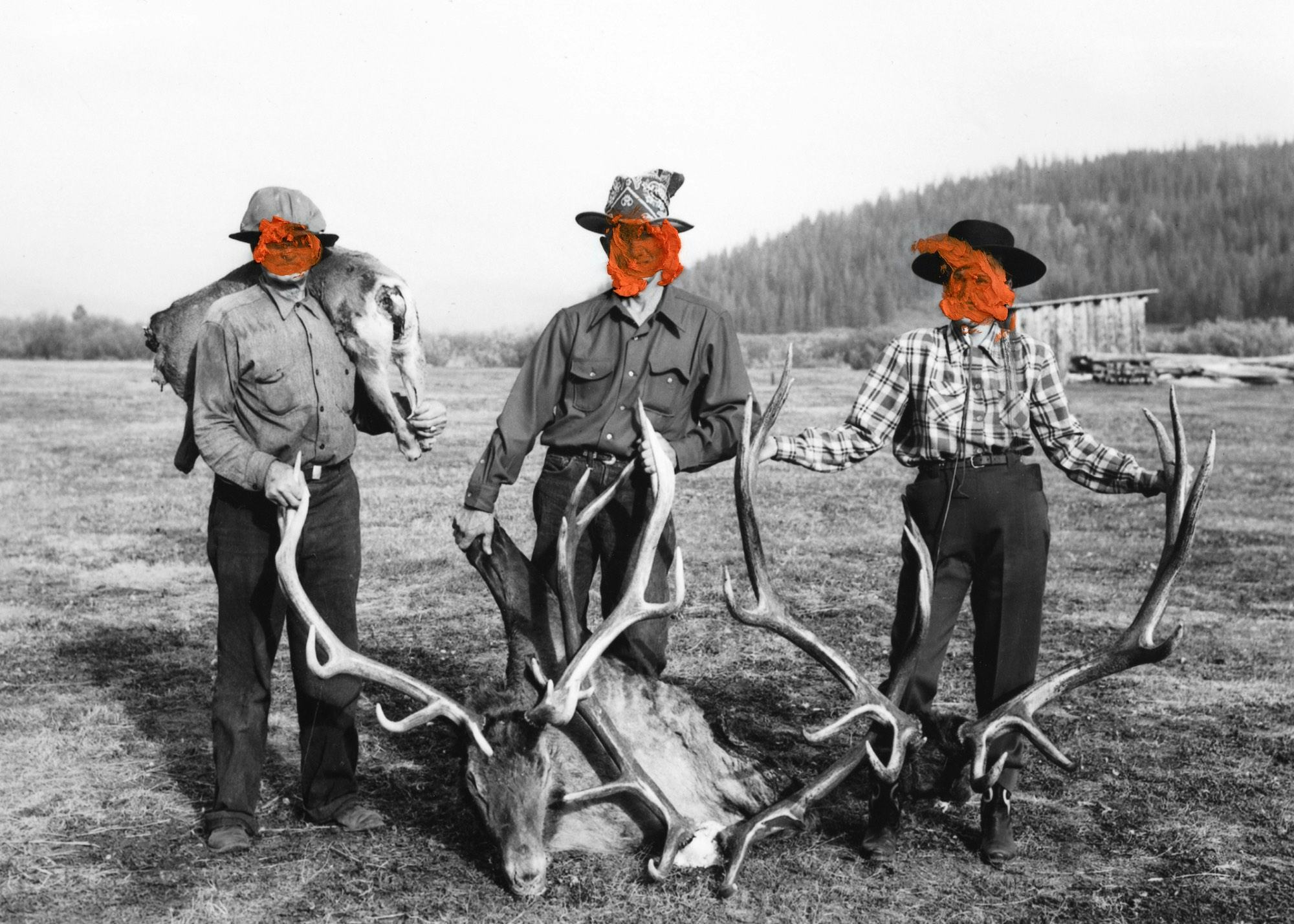 Archival image of three men posing with two sets of antlers, their faces covered in red paint © Jaclyn Wright
