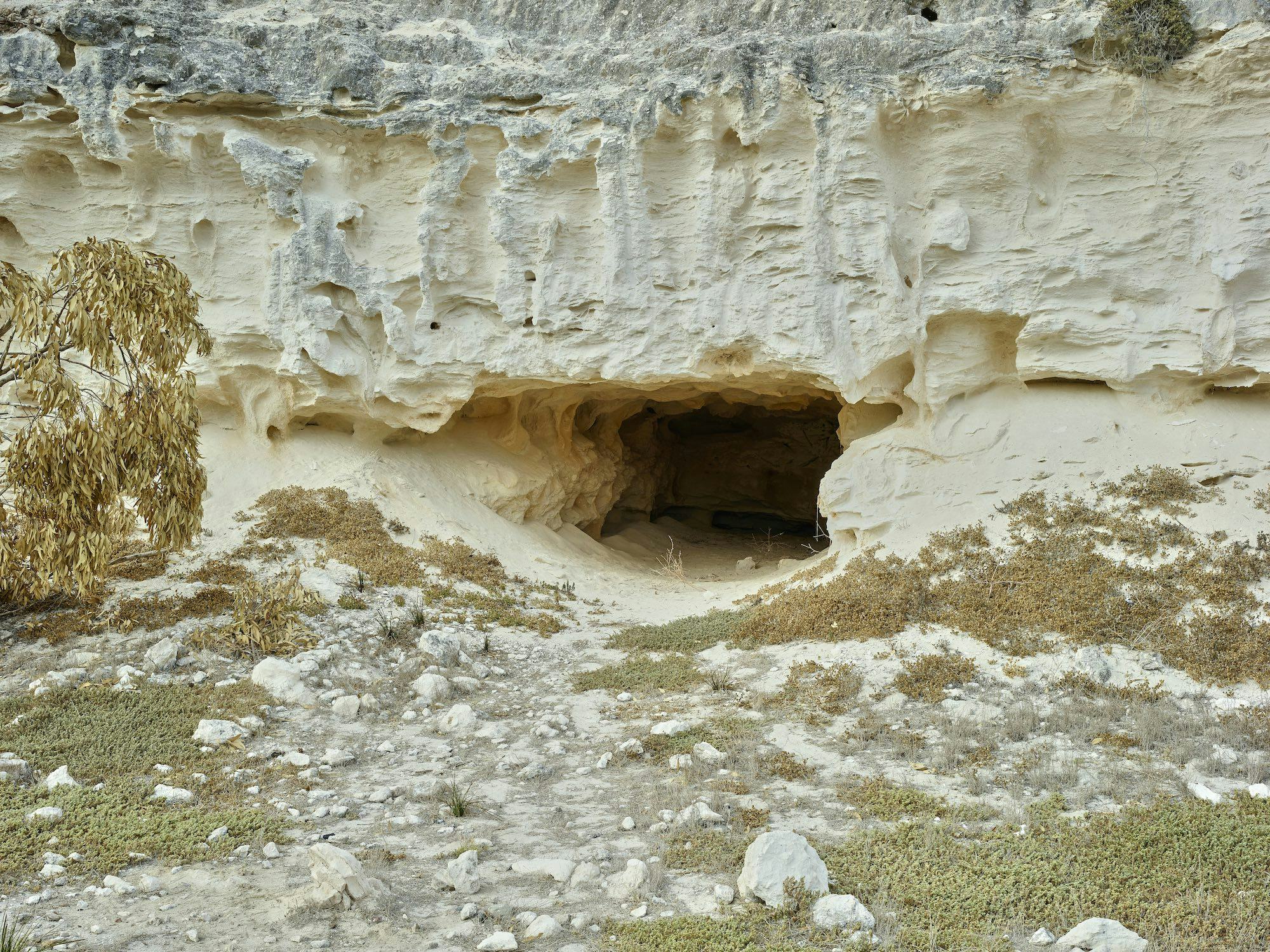 Photograph of the entrance of a cave on Robben Island © Thero Makepe