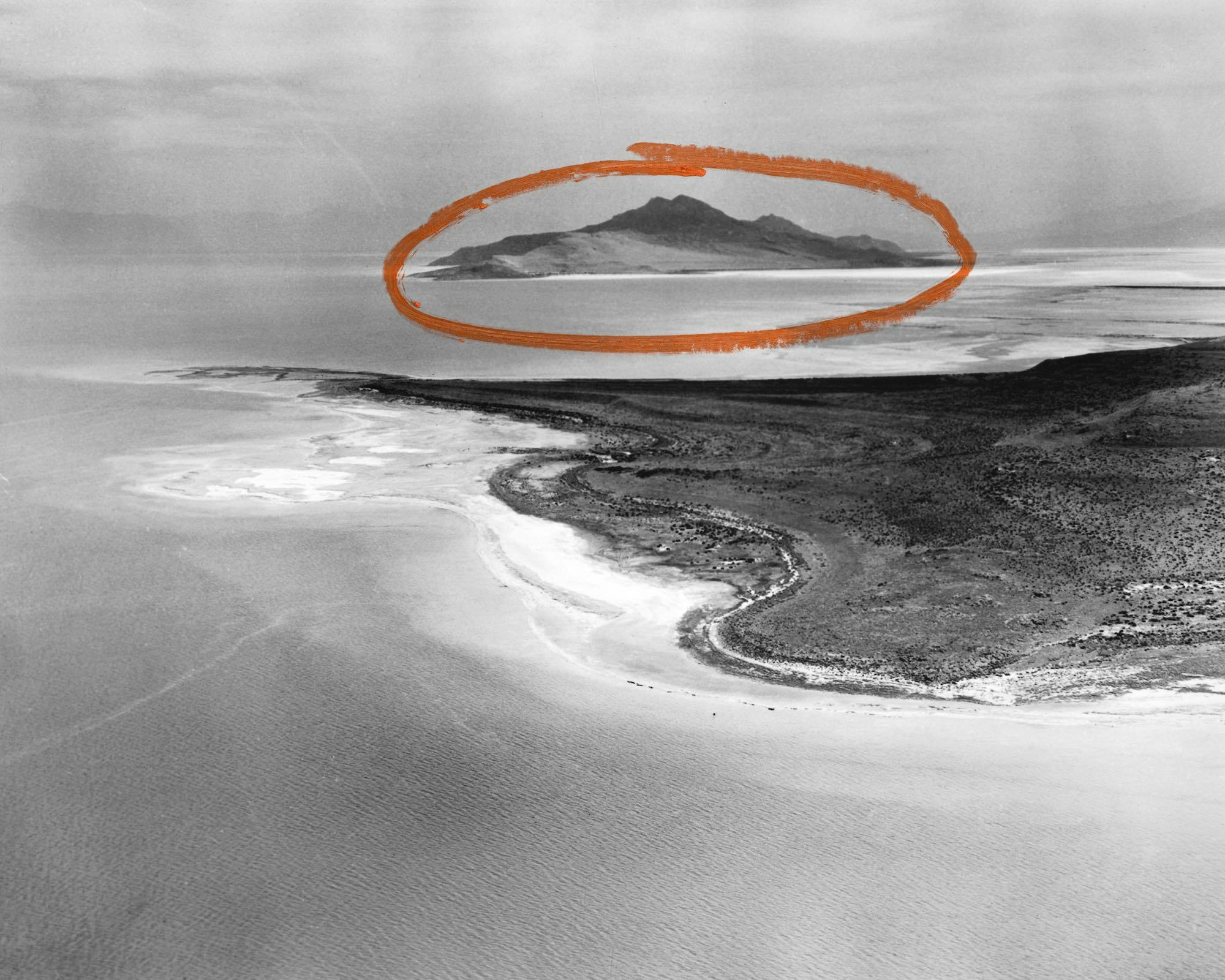Archival aerial image of Stansbury Island in the Great Salt Lake (Utah), with two arrows in red paint drawn on top. © Jaclyn Wright