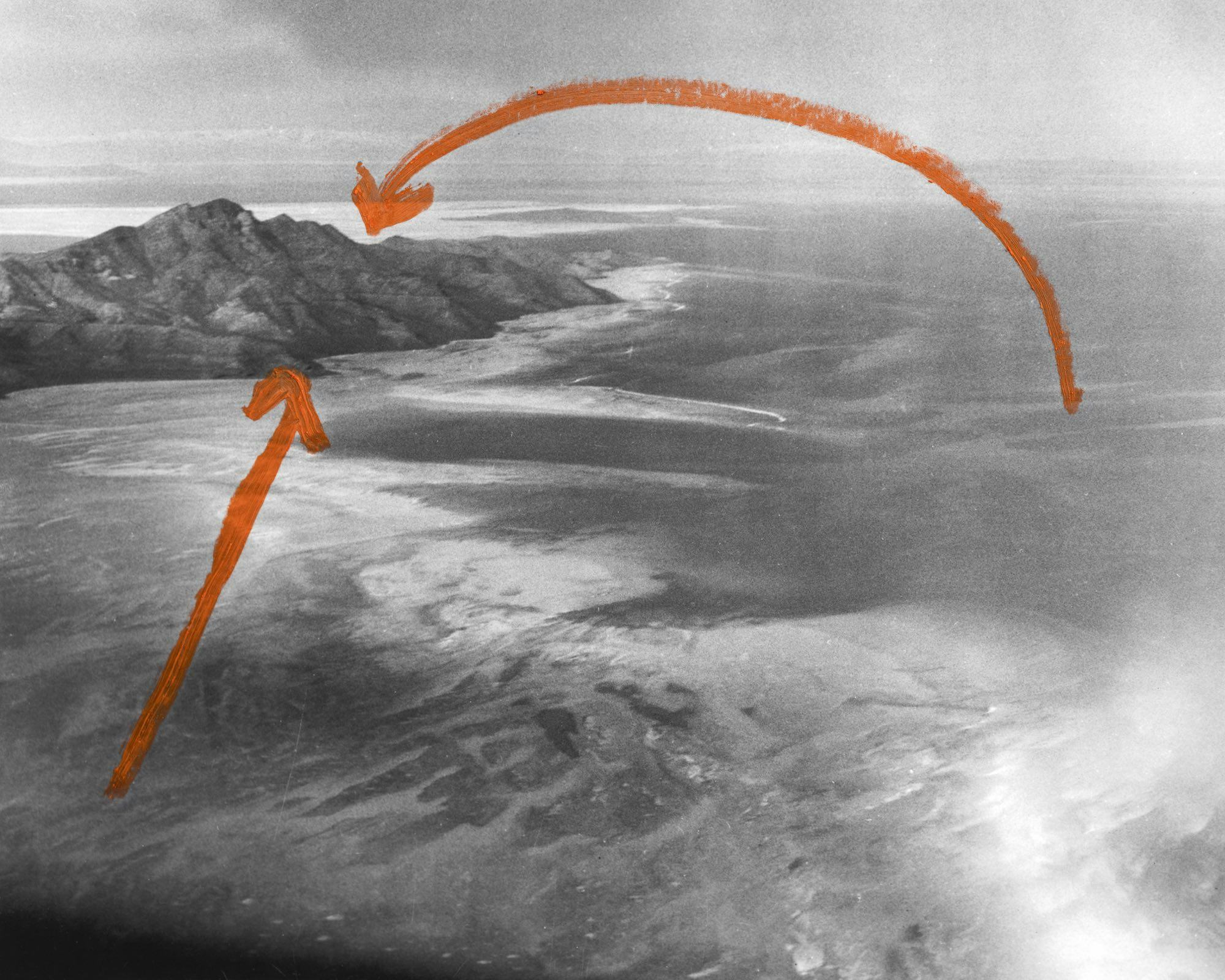 Archival aerial image of Stansbury Island in the Great Salt Lake (Utah), with two arrows in red paint drawn on top. © Jaclyn Wright