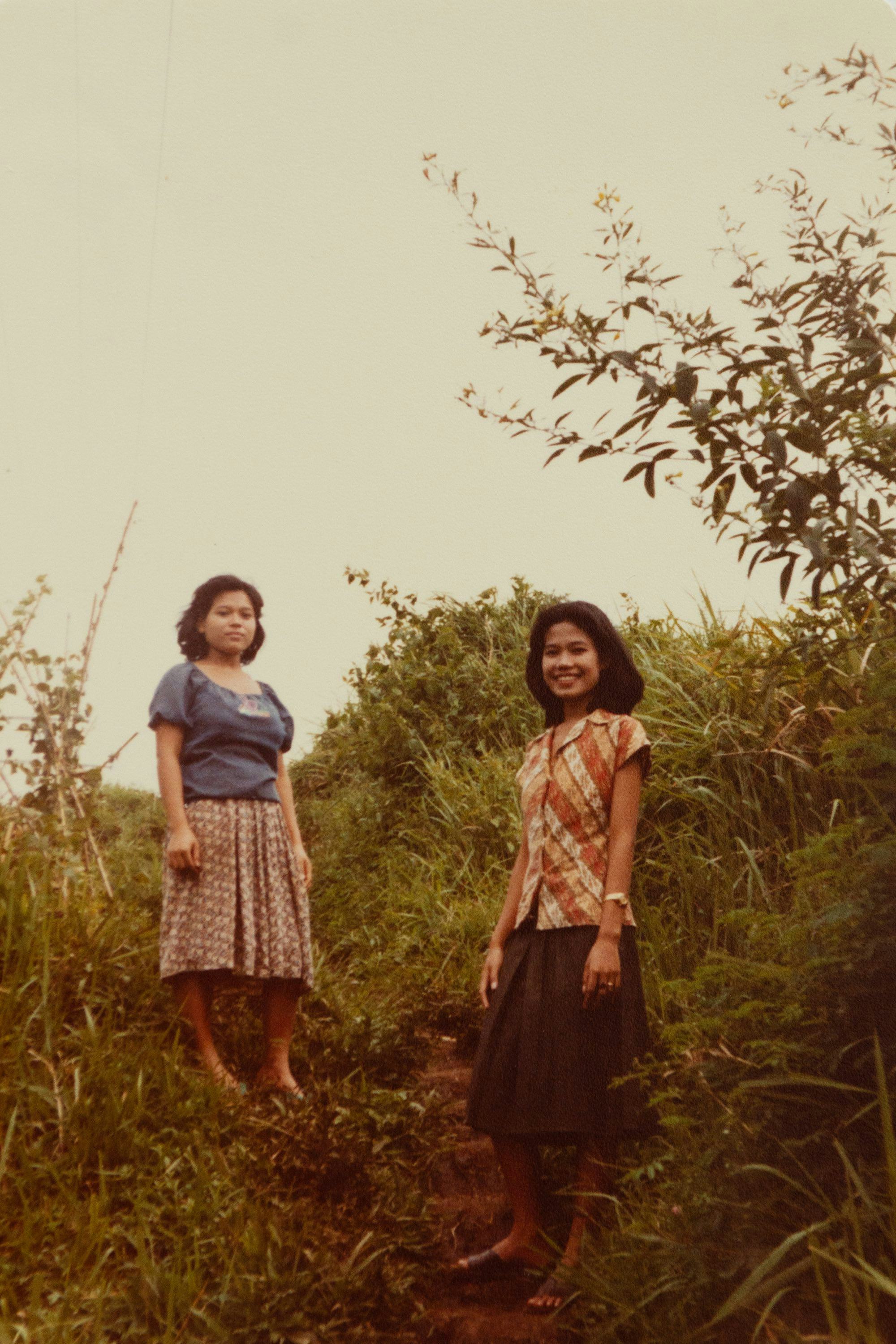Archival picture from the artist's personal archive, showing two women posing on a hillside© Sander Coers
