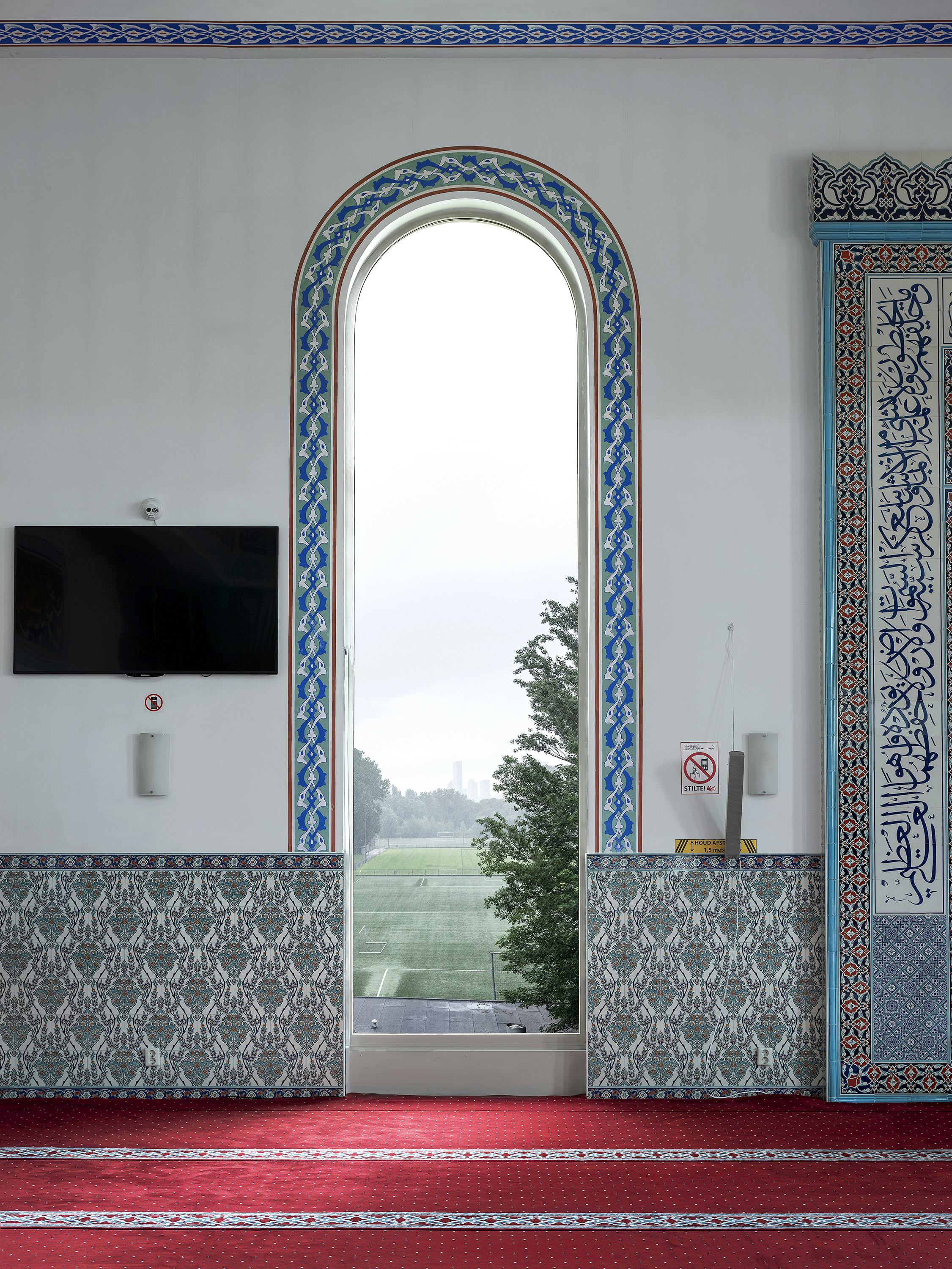 View from inside a mosque onto a Dutch landscape