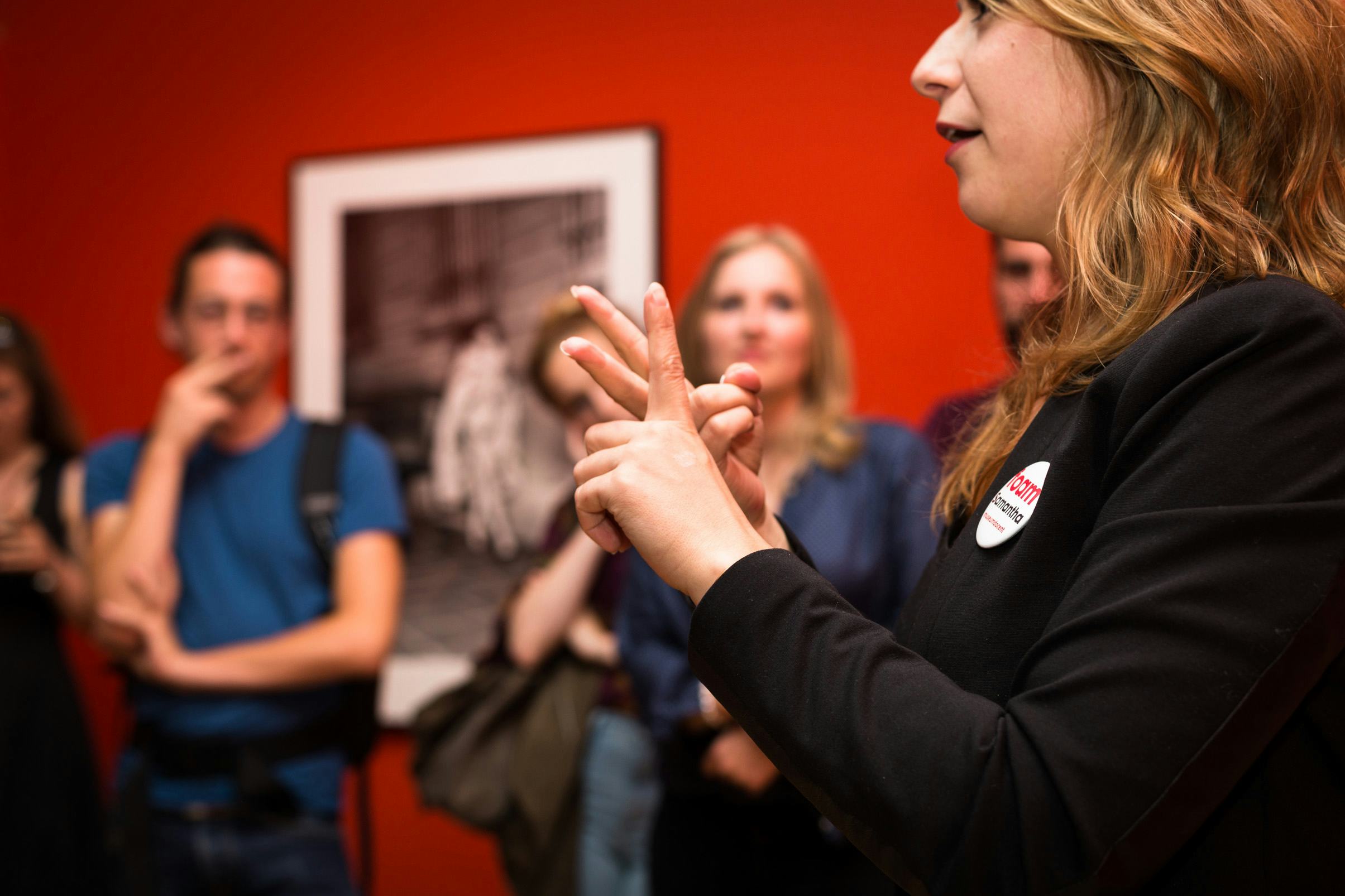 Museum teacher gives a tour in sign language