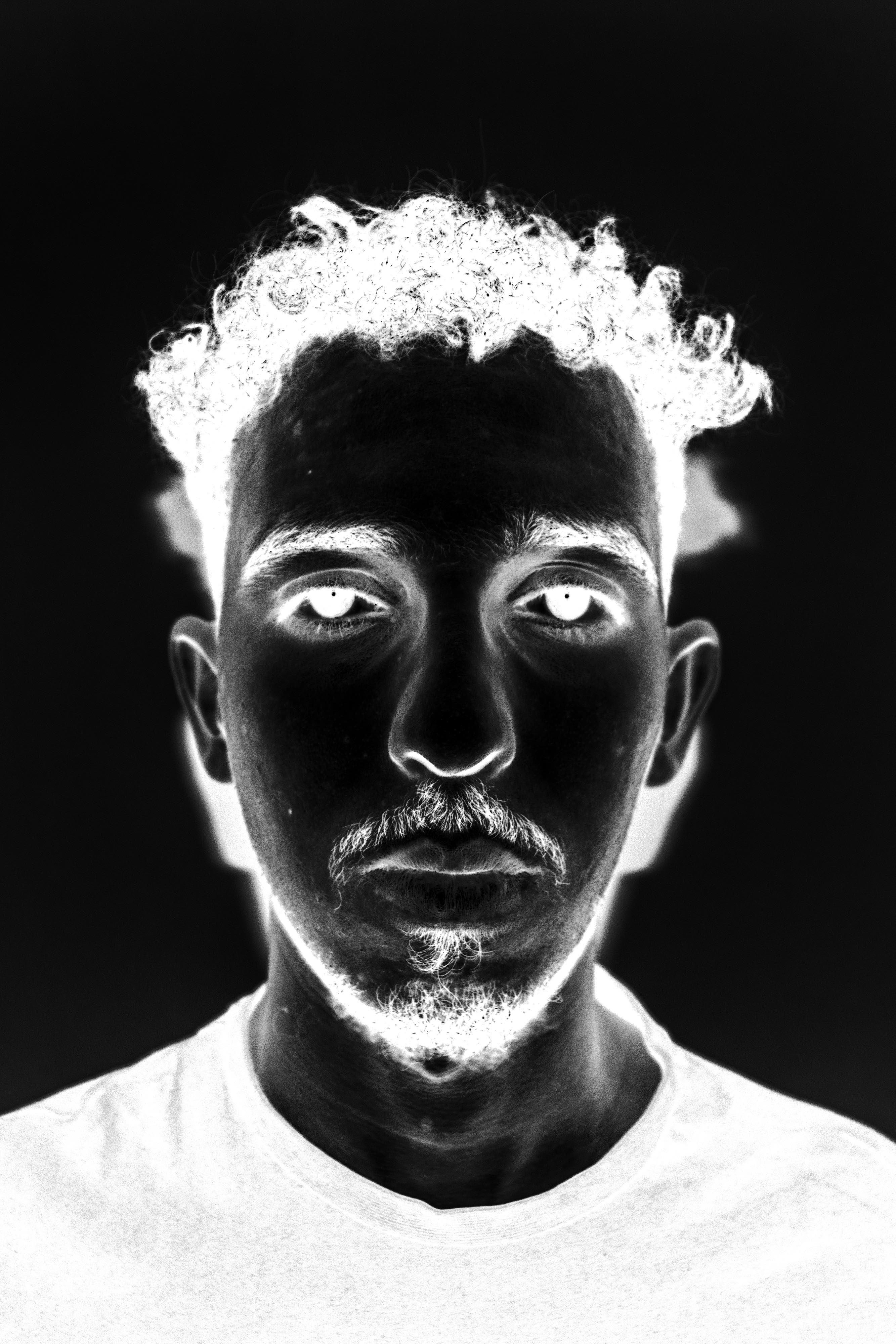 Negative portrait of a young man © Issam Larkat