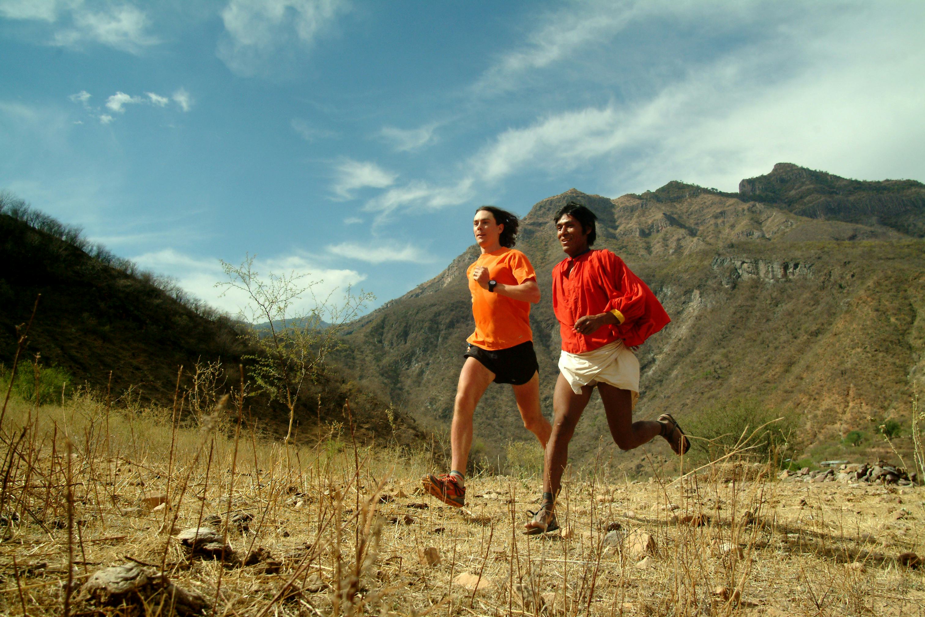 two people running in a rural setting