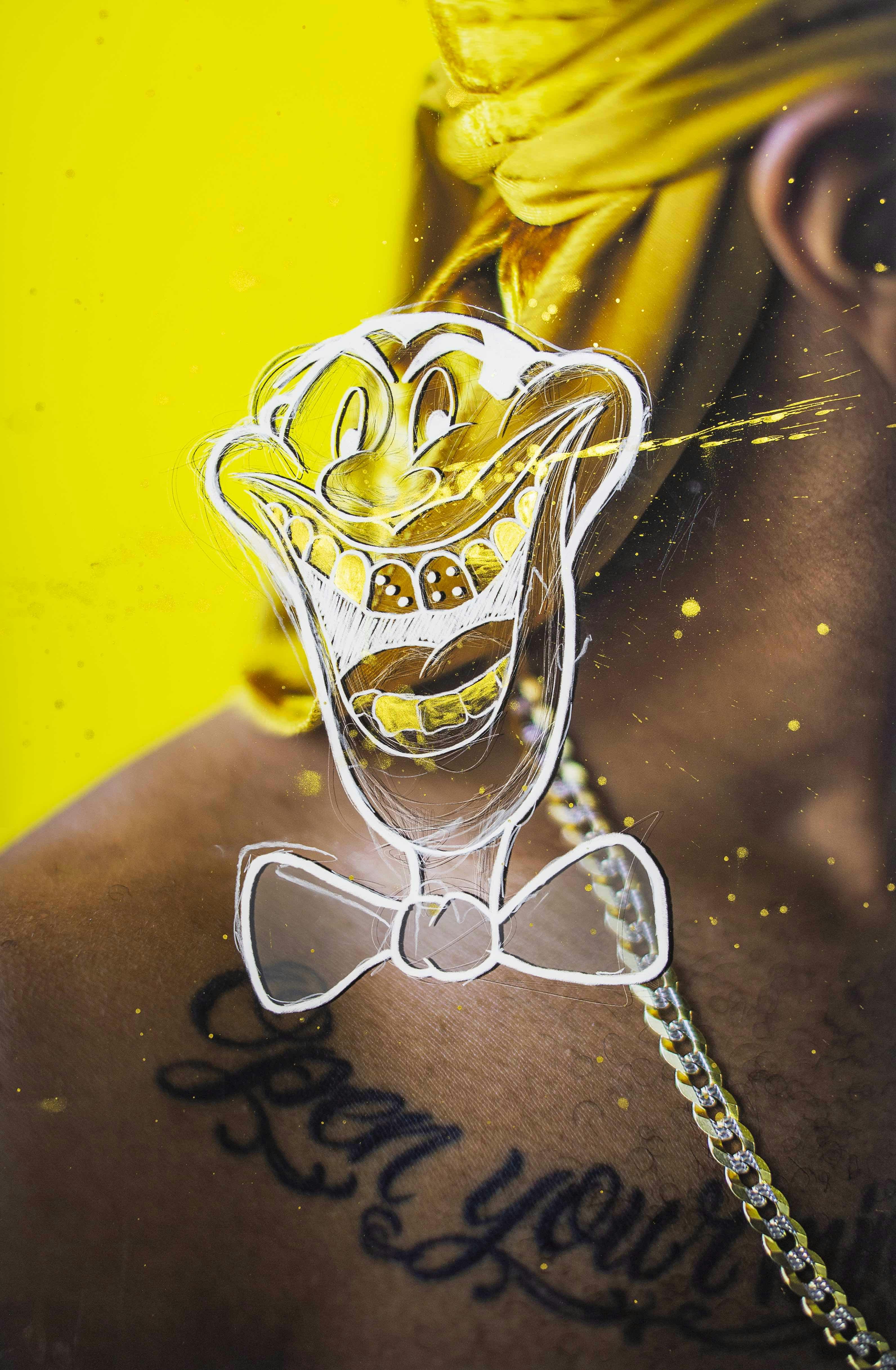 Close-up image of a Black man's neck and shoulder, showing a tattoo and a yellow background and a caricature drawing on top. © André Ramos-Woodard