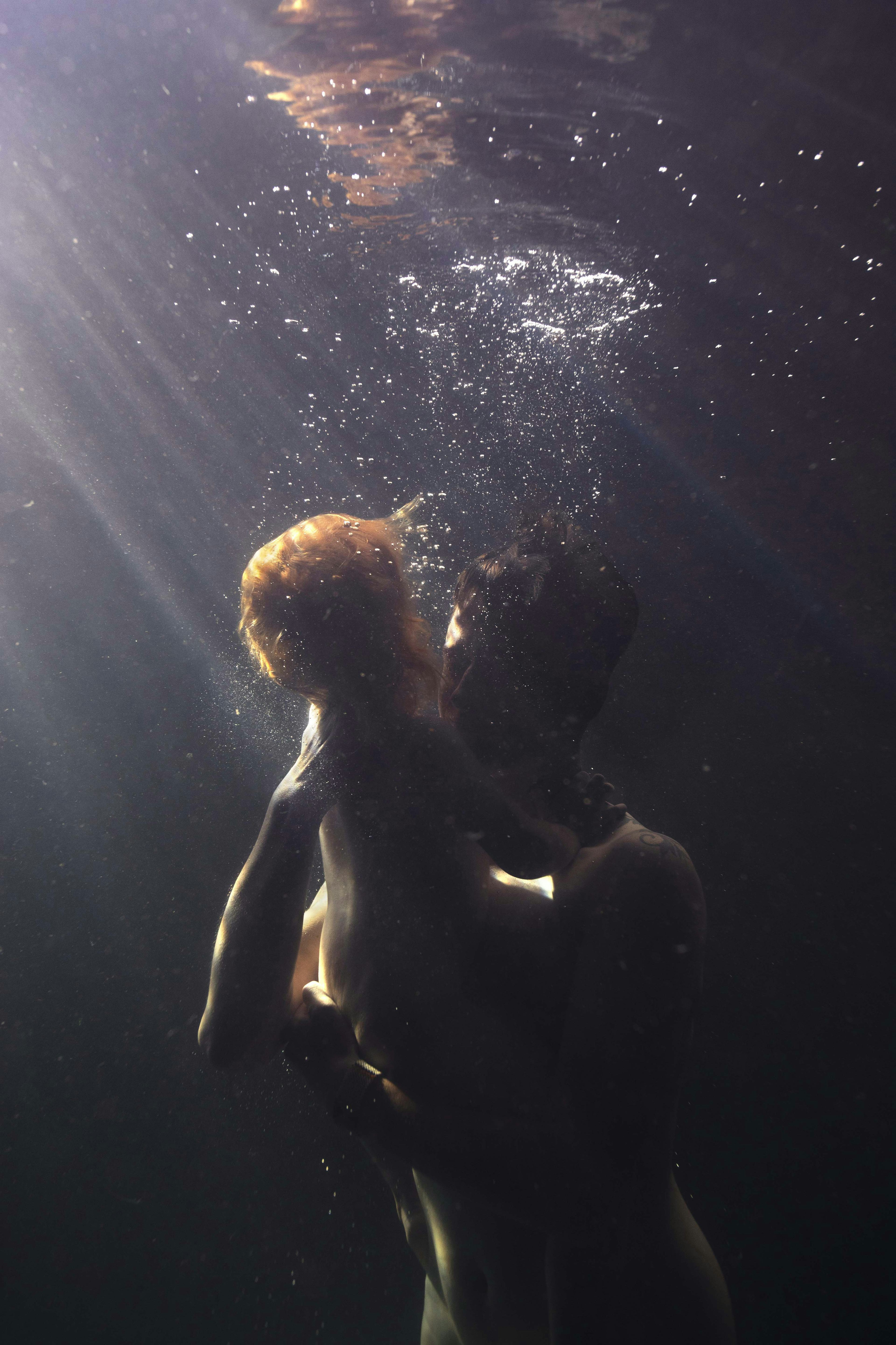 person carrying child in deep waters