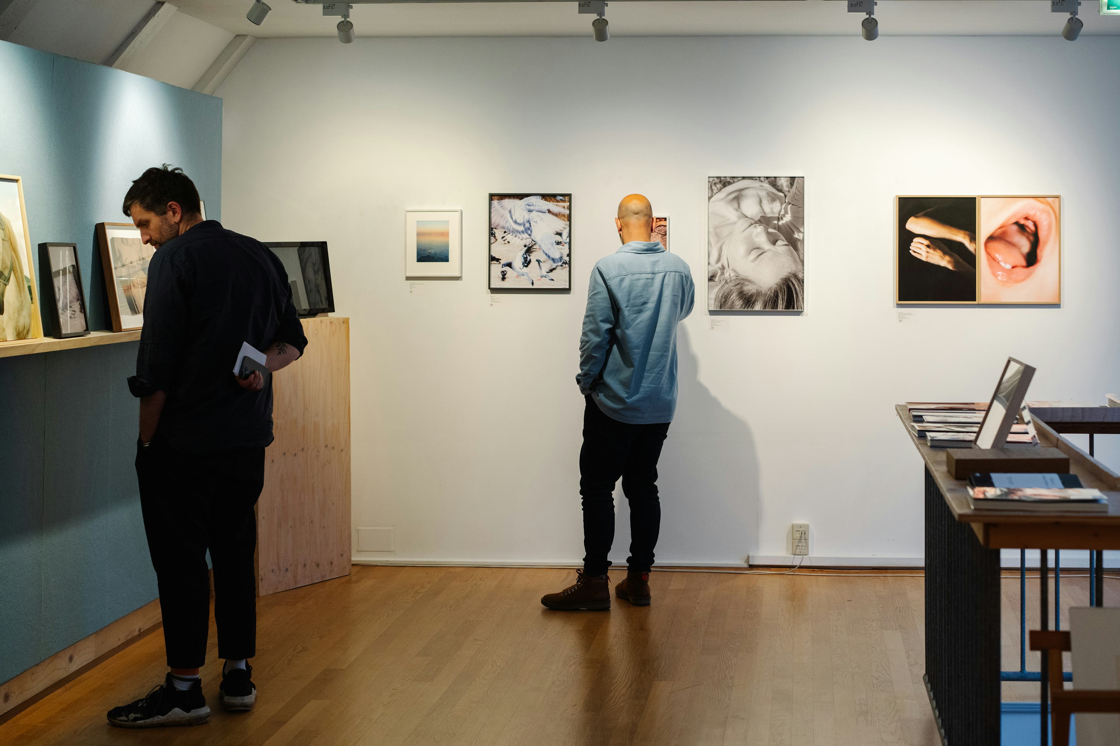 Image of people browsing artworks at Foam Editions, Foam's in-house gallery